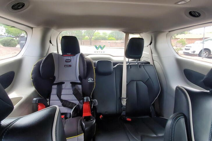 Child car seat is pictured inside a fully autonomous Waymo robotaxi in Tempe