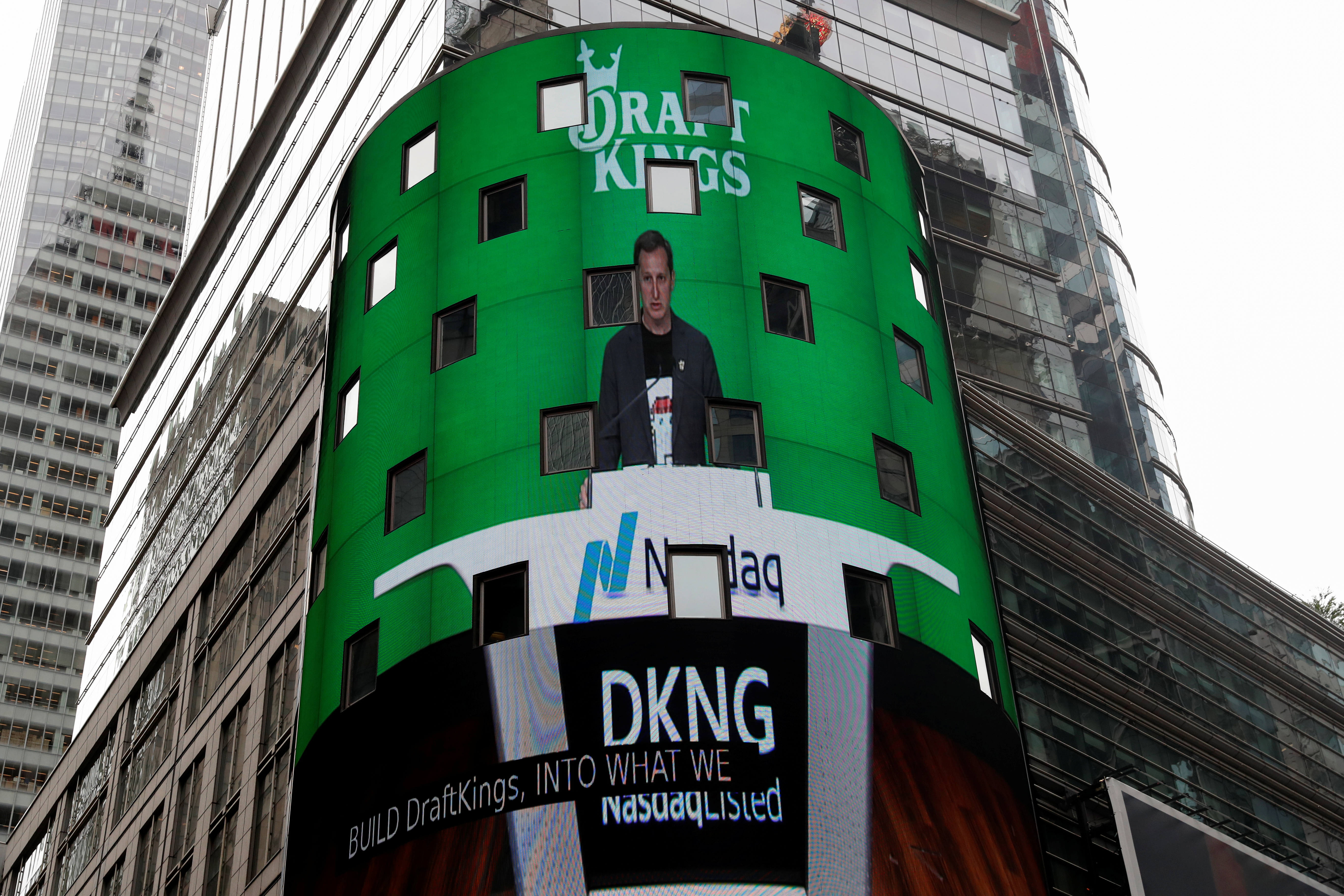 Jason Robins, CEO of DraftKings, is displayed at the Nasdaq MarketSite jumbotron, in New York City
