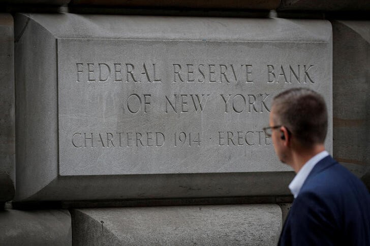 A man walks outside The Federal Reserve Bank of New York