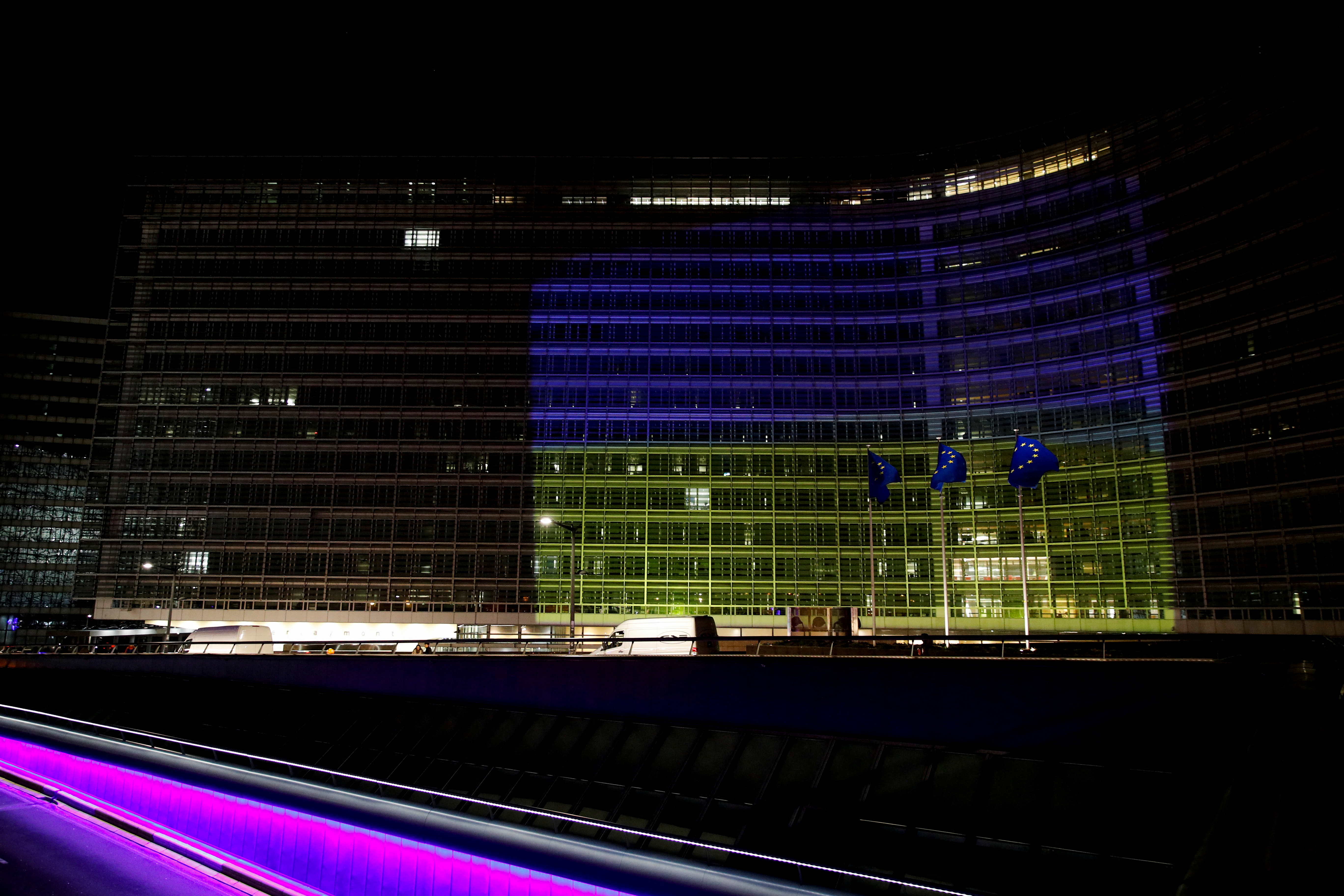 European Commission is illuminated in Ukrainian colours, in Brussels