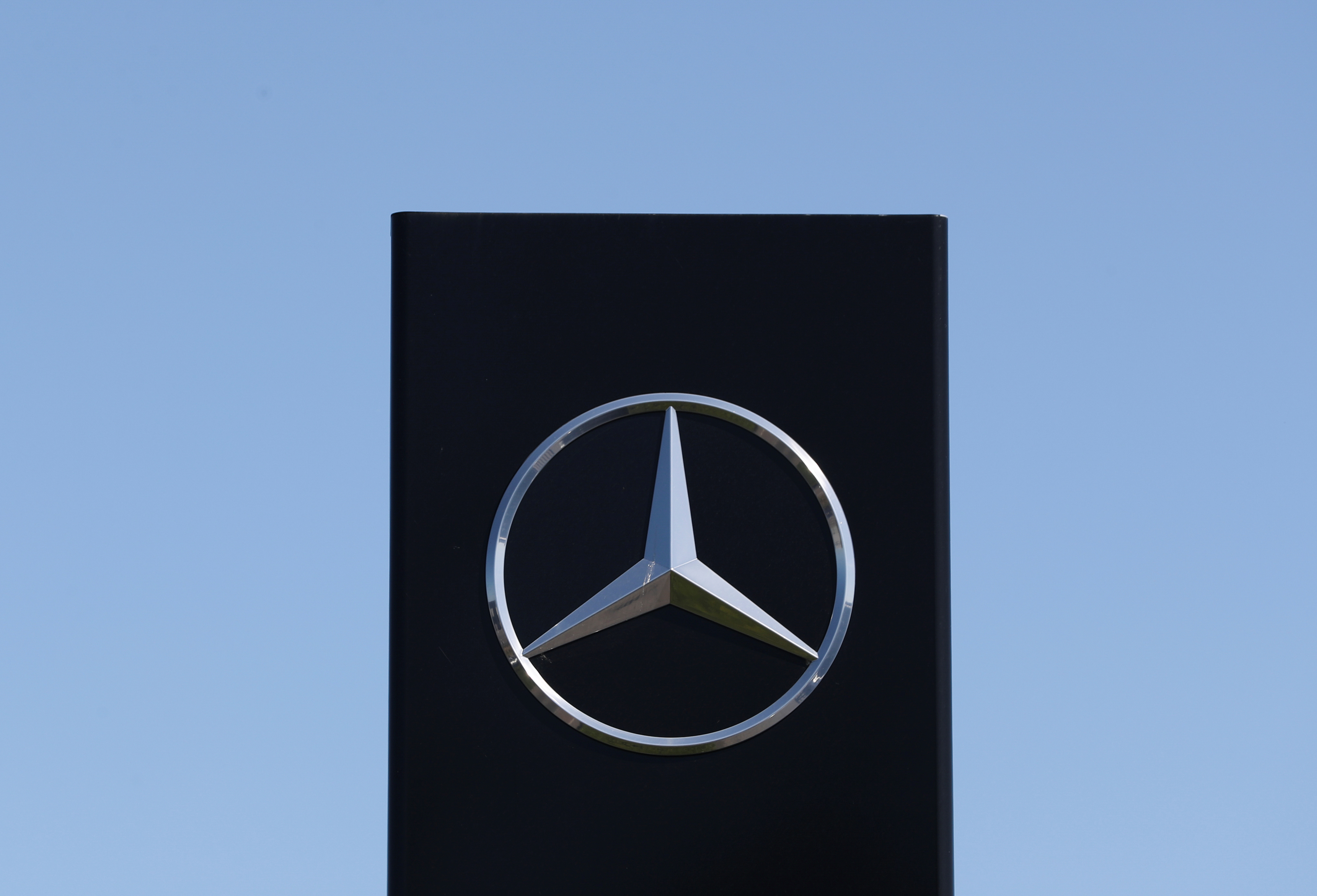 A logo of Mercedes-Benz is seen outside a Mercedes-Benz car dealer, amid the coronavirus disease (COVID-19) outbreak in Brussels