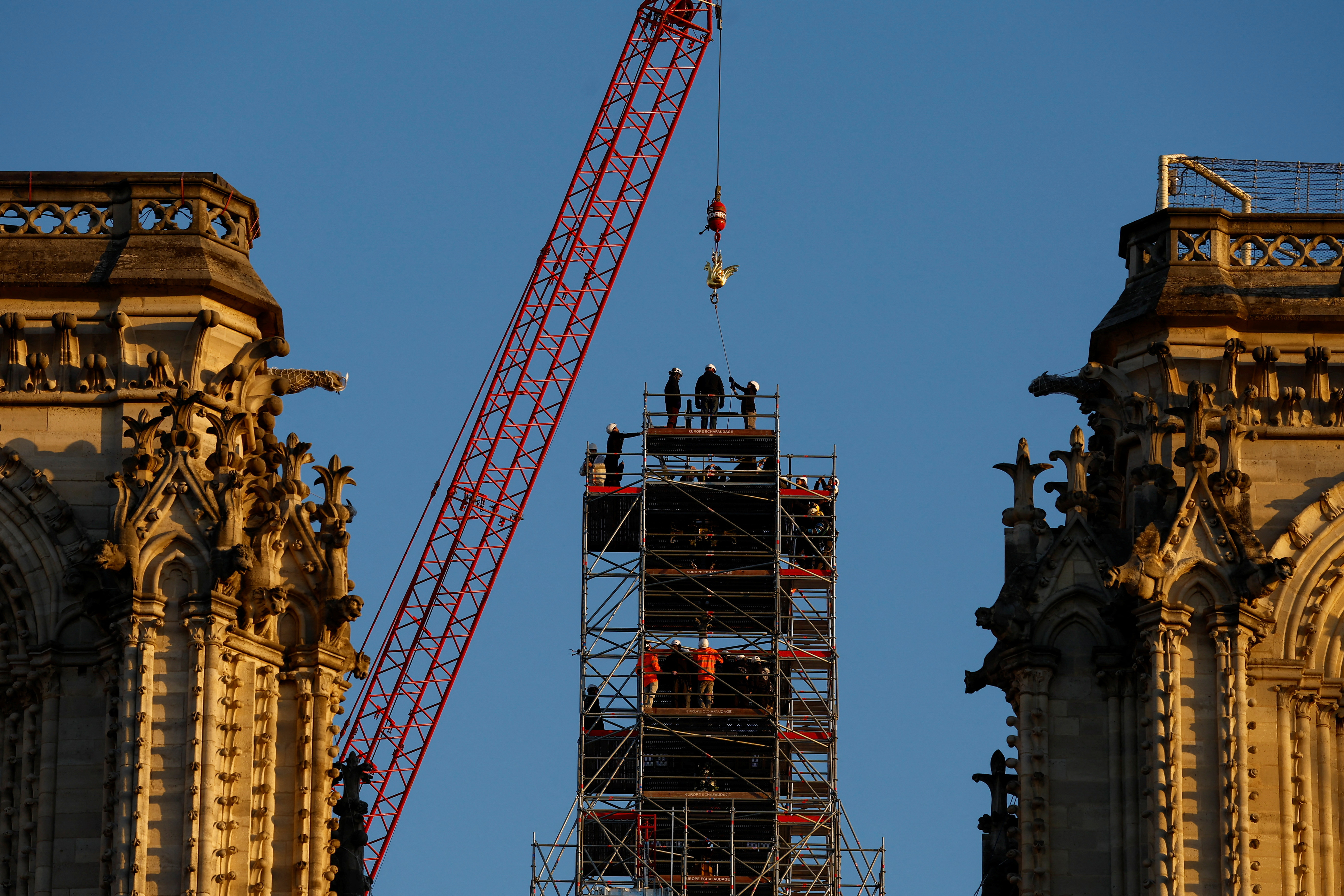Paris's Notre-Dame spire is crowned by new golden rooster to symbolize  rebirth
