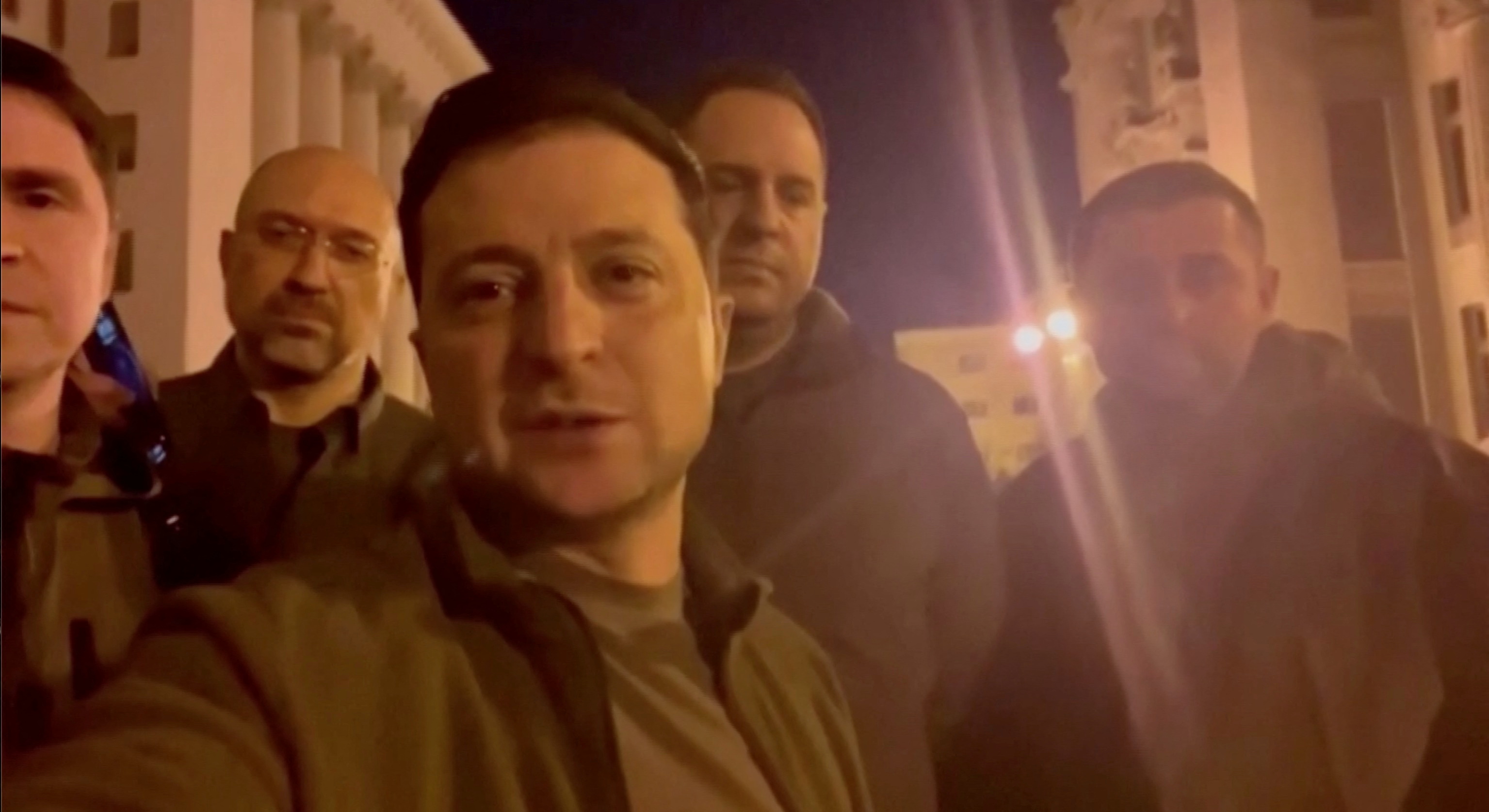 Ukrainian President Volodymyr Zelenskiy speaks alongside other Ukrainian officials in the governmental district of Kyiv, confirming that he is still in the capital, in Kyiv, Ukraine February 25, 2022 in this screengrab obtained from a handout video. Ukrainian Presidential Press Service/Handout via REUTERS 
