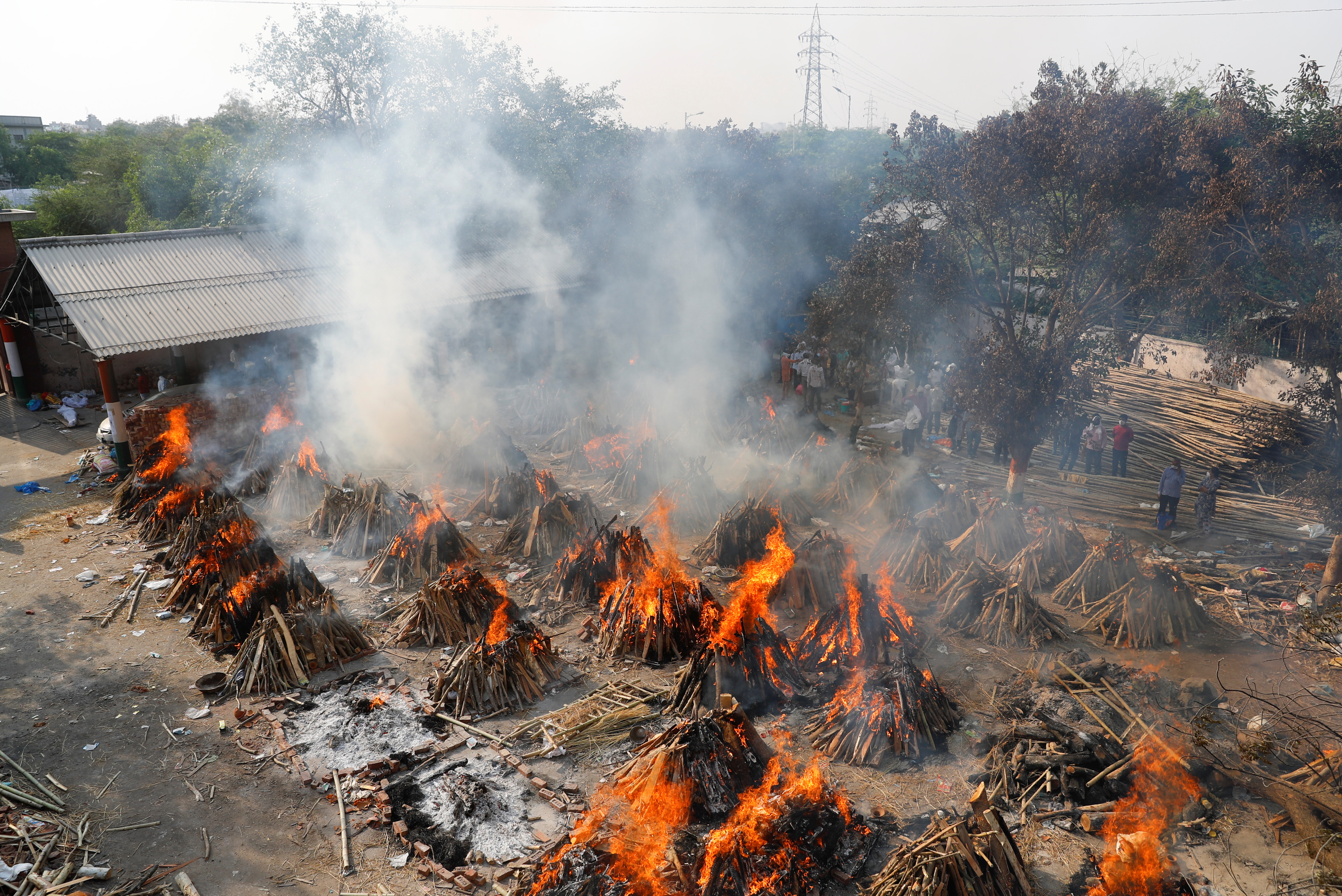 Mass cremation of those who died from COVID-19, at a crematorium in New Delhi