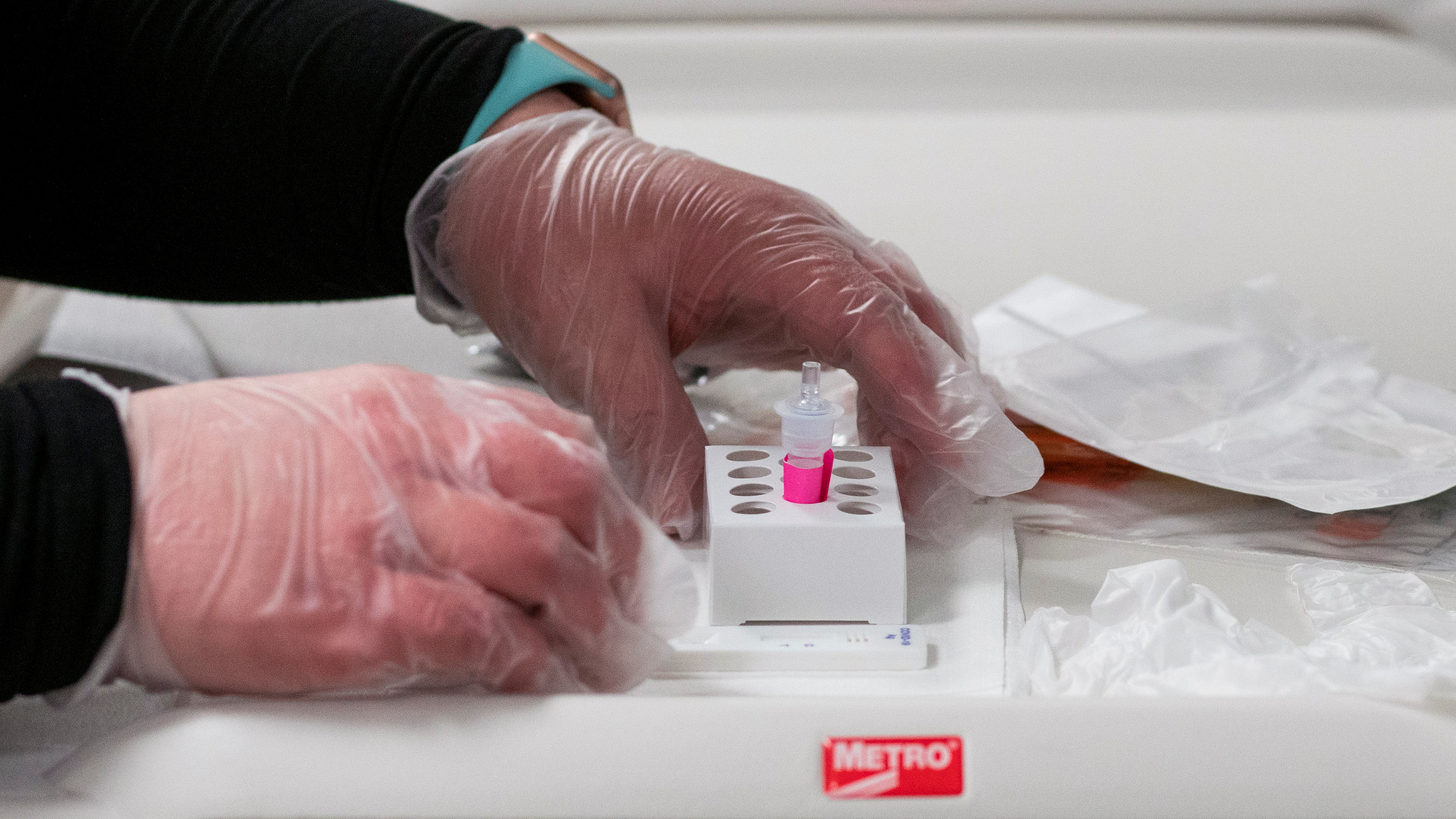 A healthcare worker prepares a coronavirus test in Elizabeth, New Jersey