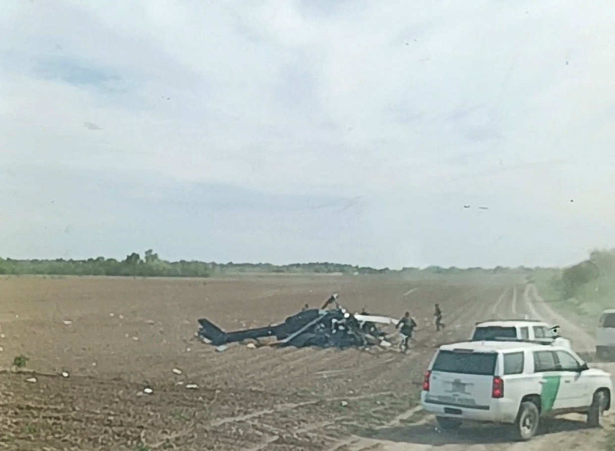 Emergency services personnel respond to a helicopter crash near La Grulla