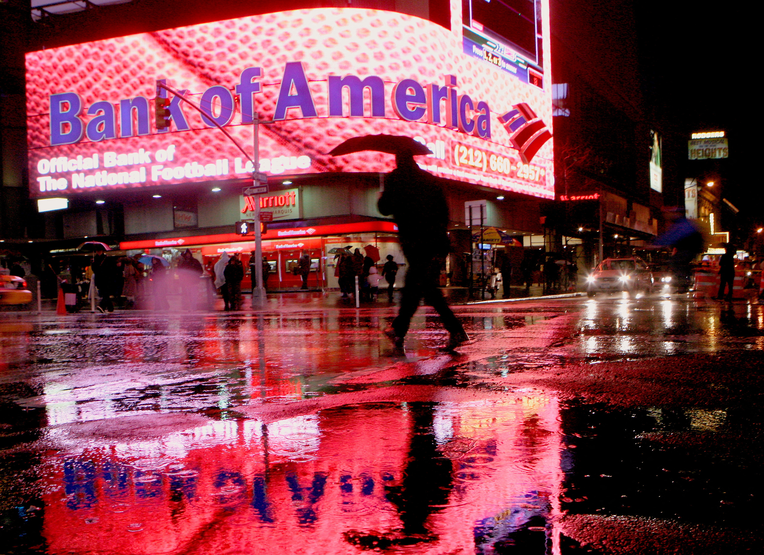 Man walks near Bank of America branch in New York's Times Square