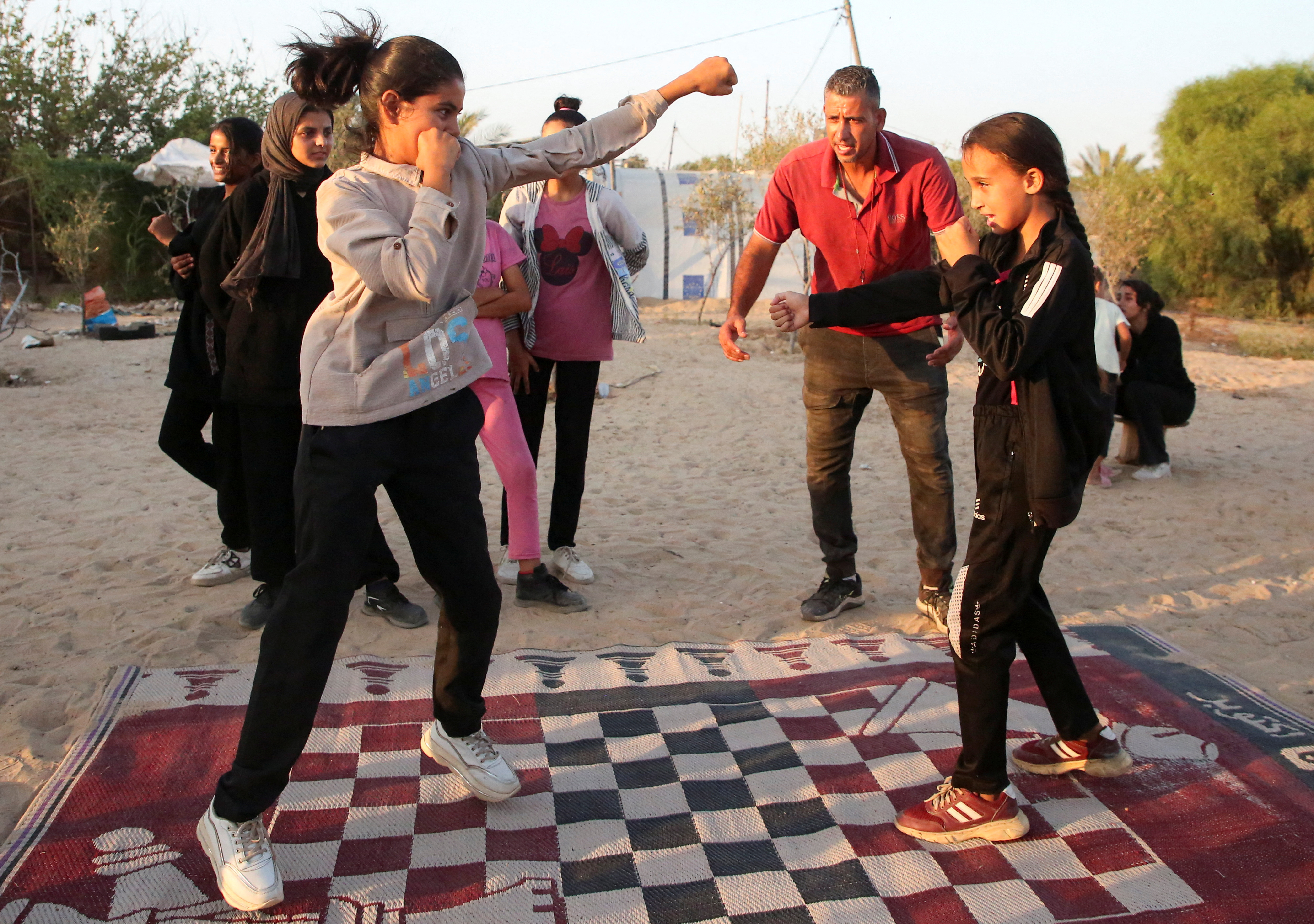 As bombs shatter Gaza, boxing coach emboldens girls