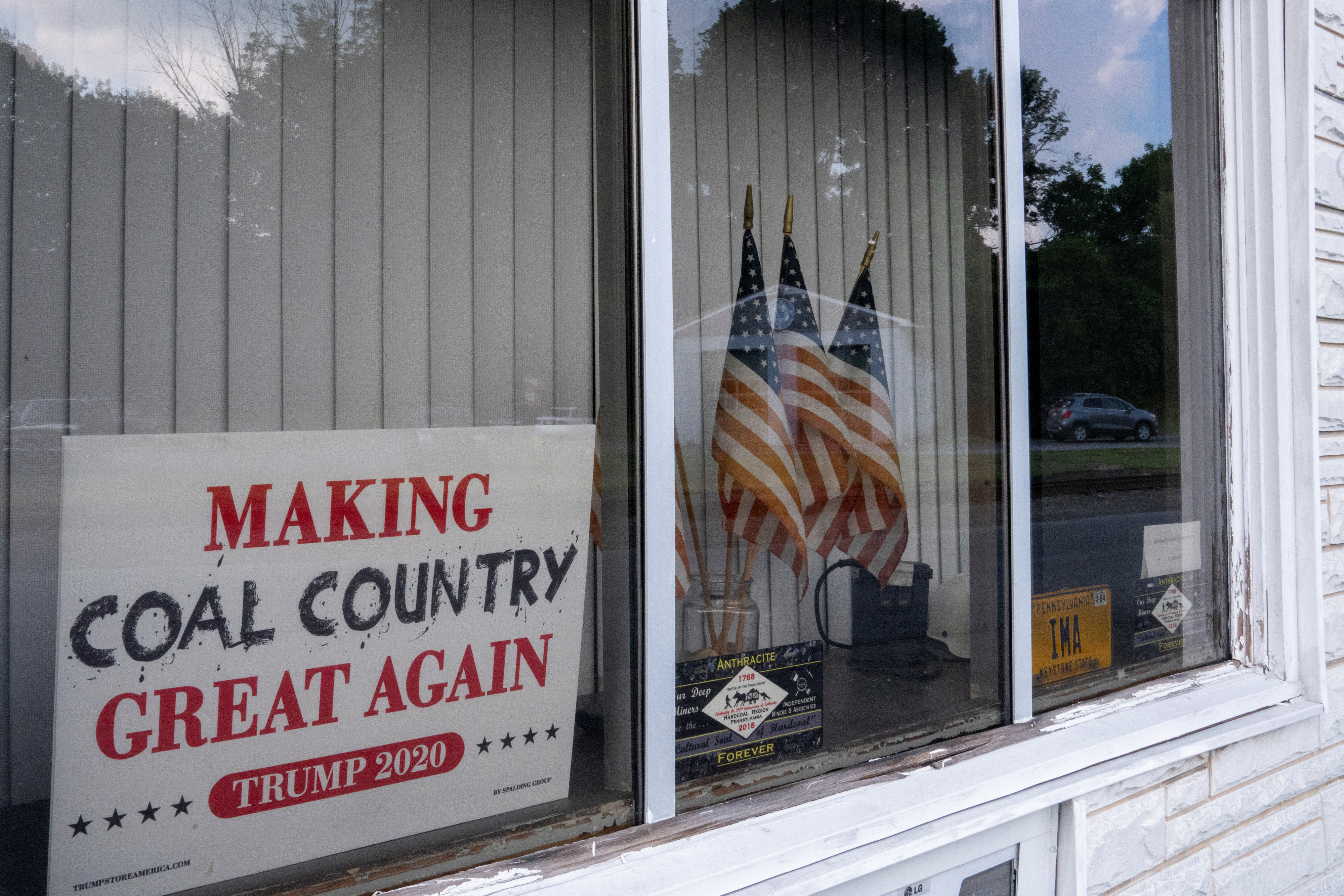 A Trump2020 sign is seen in the window of the Independent Miners & Associates office,
