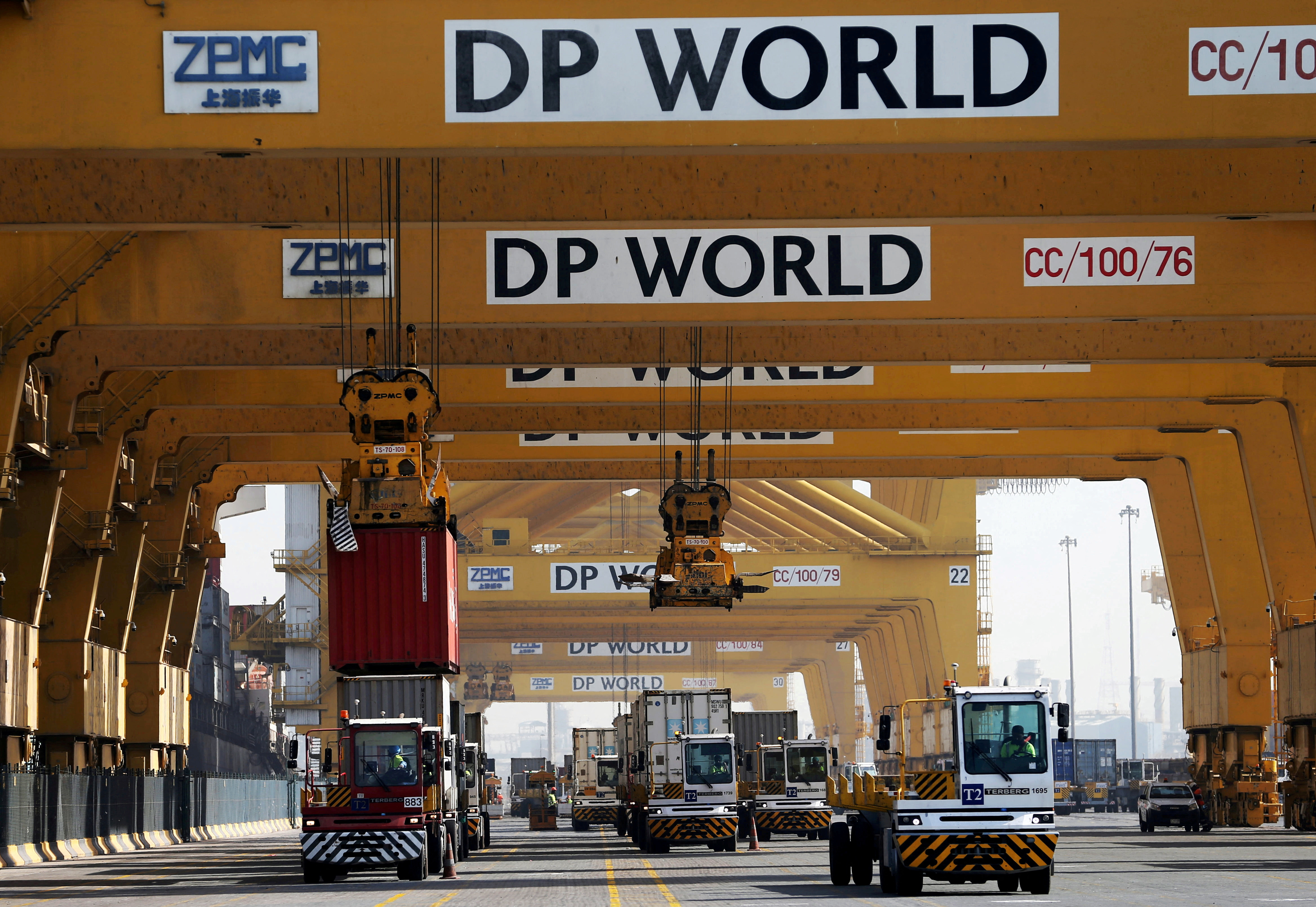 Terminal tractors line up to load containers at DP World's Terminal 2 at Jebel Ali Port in Dubai