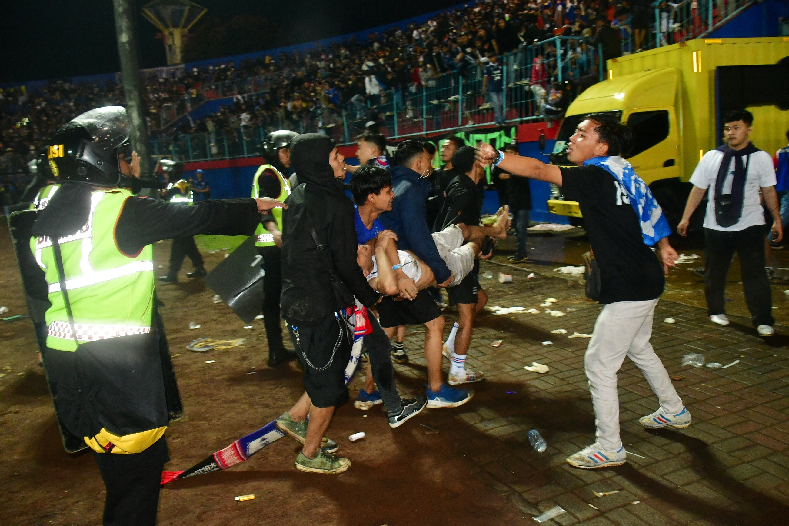 Indonesia Soccer Stampede Kills 125 After Police Use Tear Gas In ...