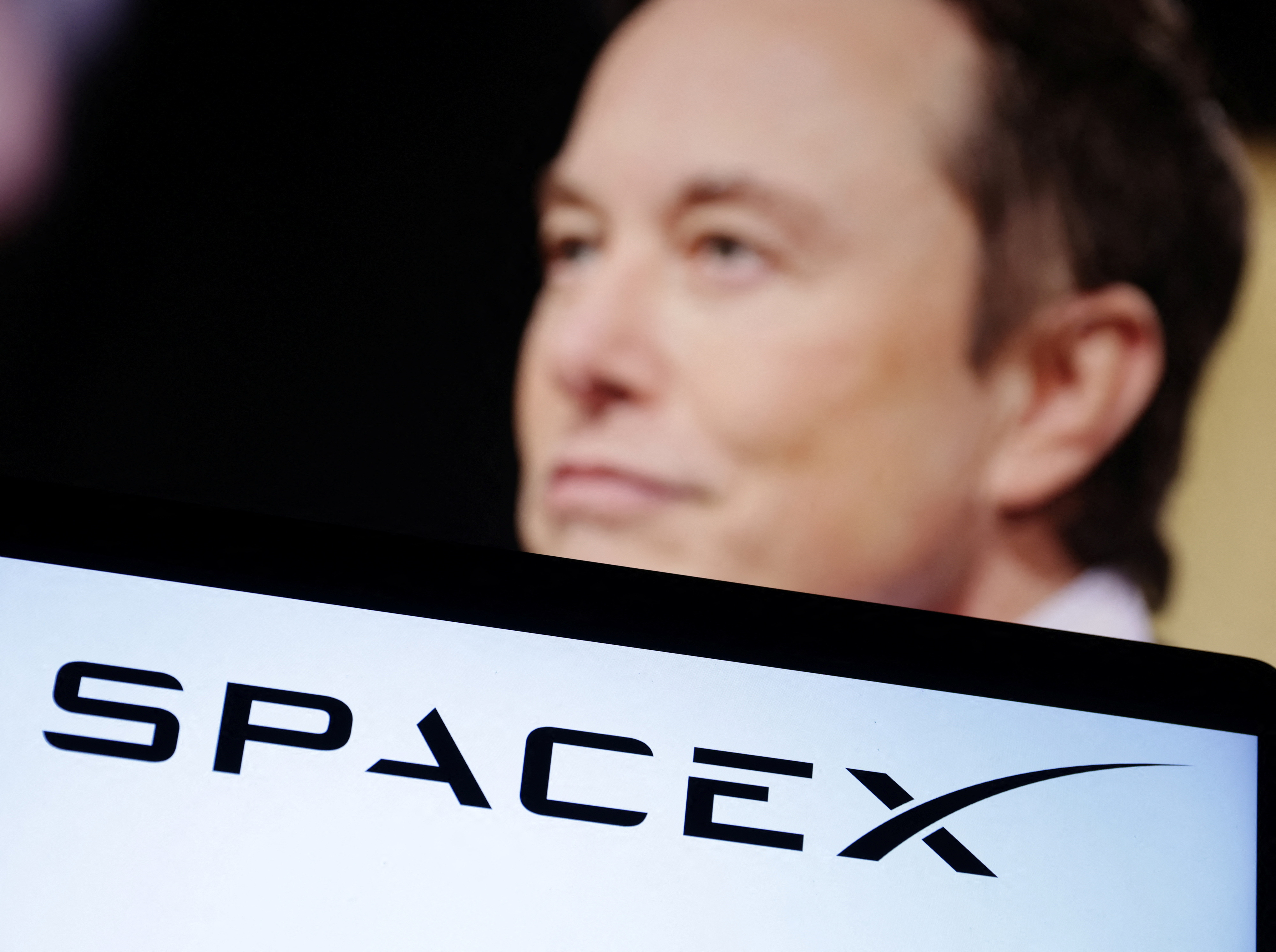 Illustration shows SpaceX logo and Elon Musk photo  SpaceX to raise $750 million at $137 billion valuation &#8211; CNBC FXOKSSGCOJLOXJ6LDLAR6UL6T4