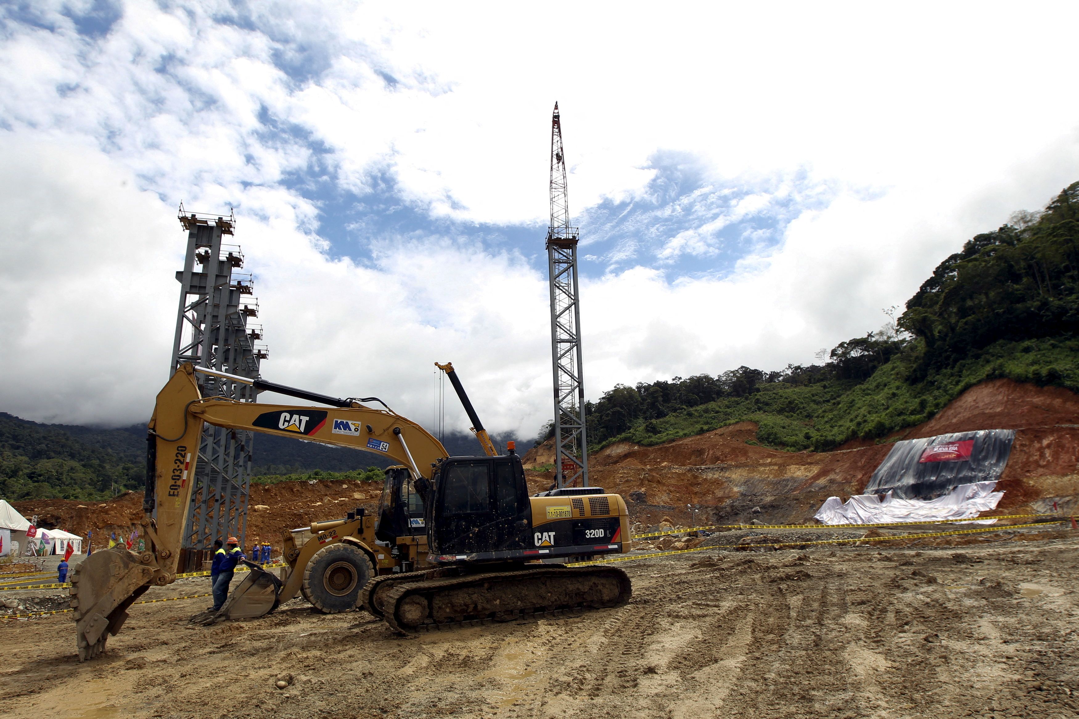 Heavy duty equipment is seen during a ceremony marking the start of construction of a mine owned by Chinese mining company  EcuaCorriente in el Pangui