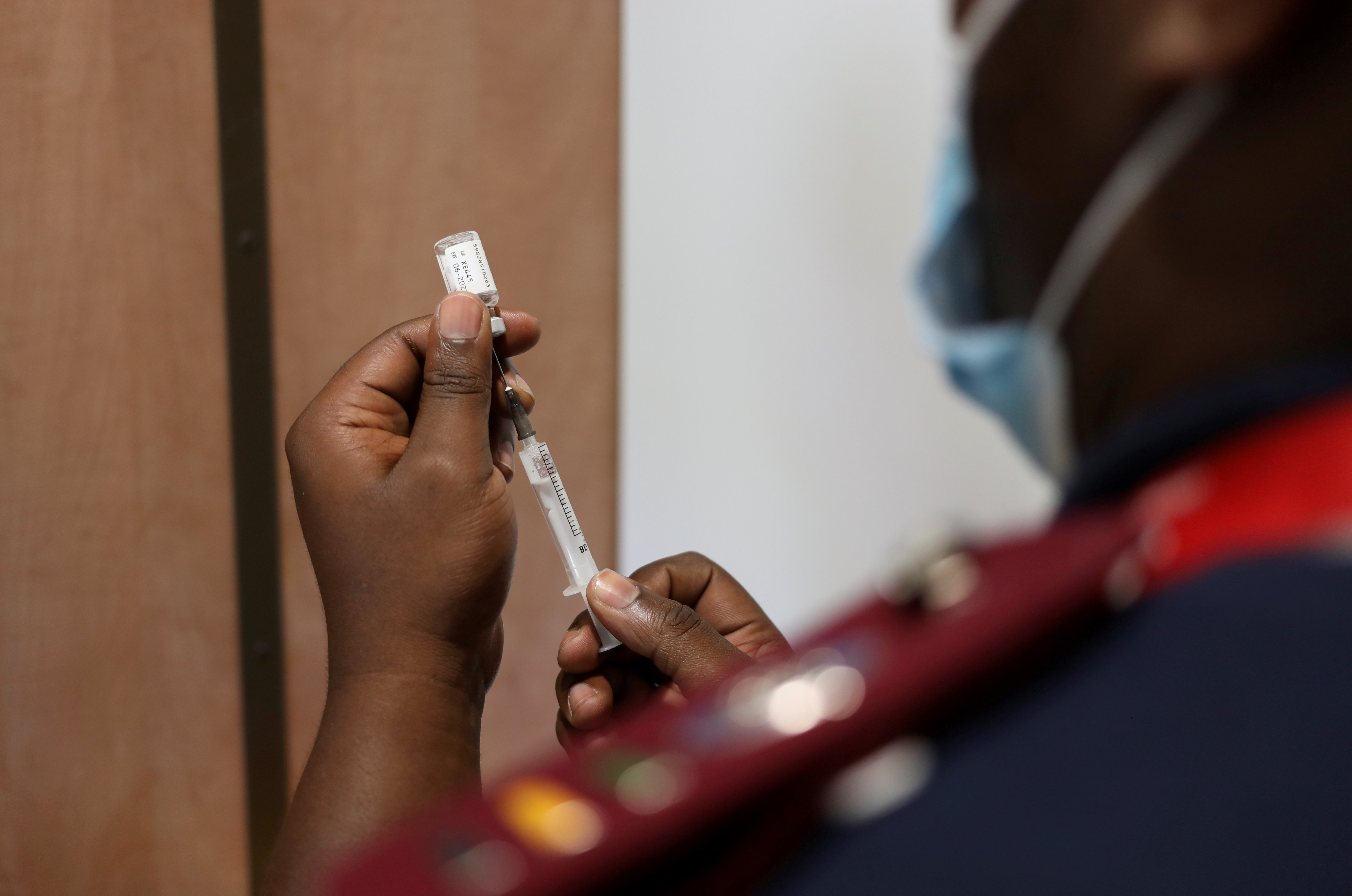 A nurse prepares a dose of the coronavirus disease (COVID-19) vaccine as the new Omicron variant spreads, in Dutywa, in the Eastern Cape province, South Africa November 29, 2021. REUTERS/Siphiwe Sibeko