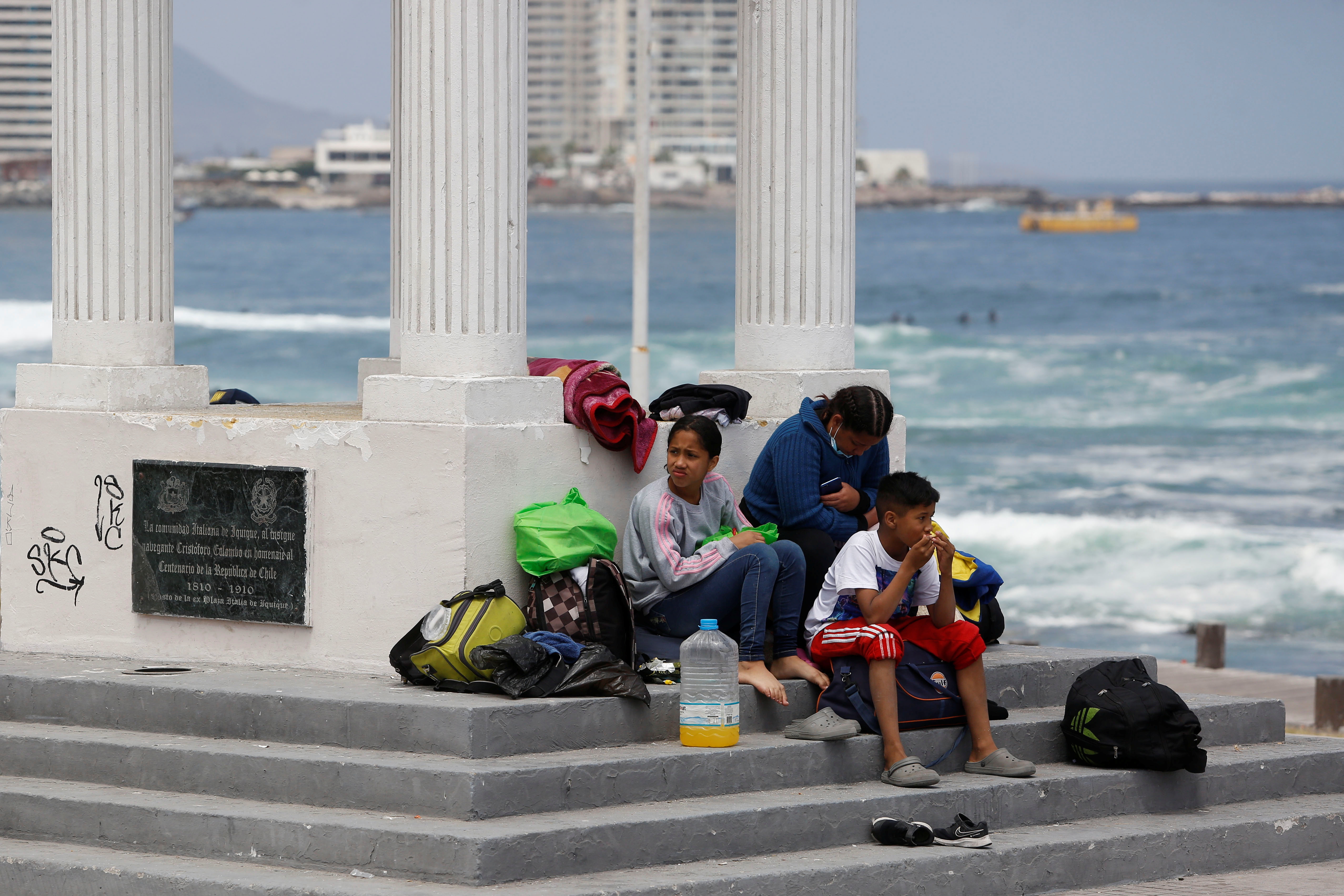 Venezuelan migrants camp next to the ocean after anti-immigration rally in Iquique