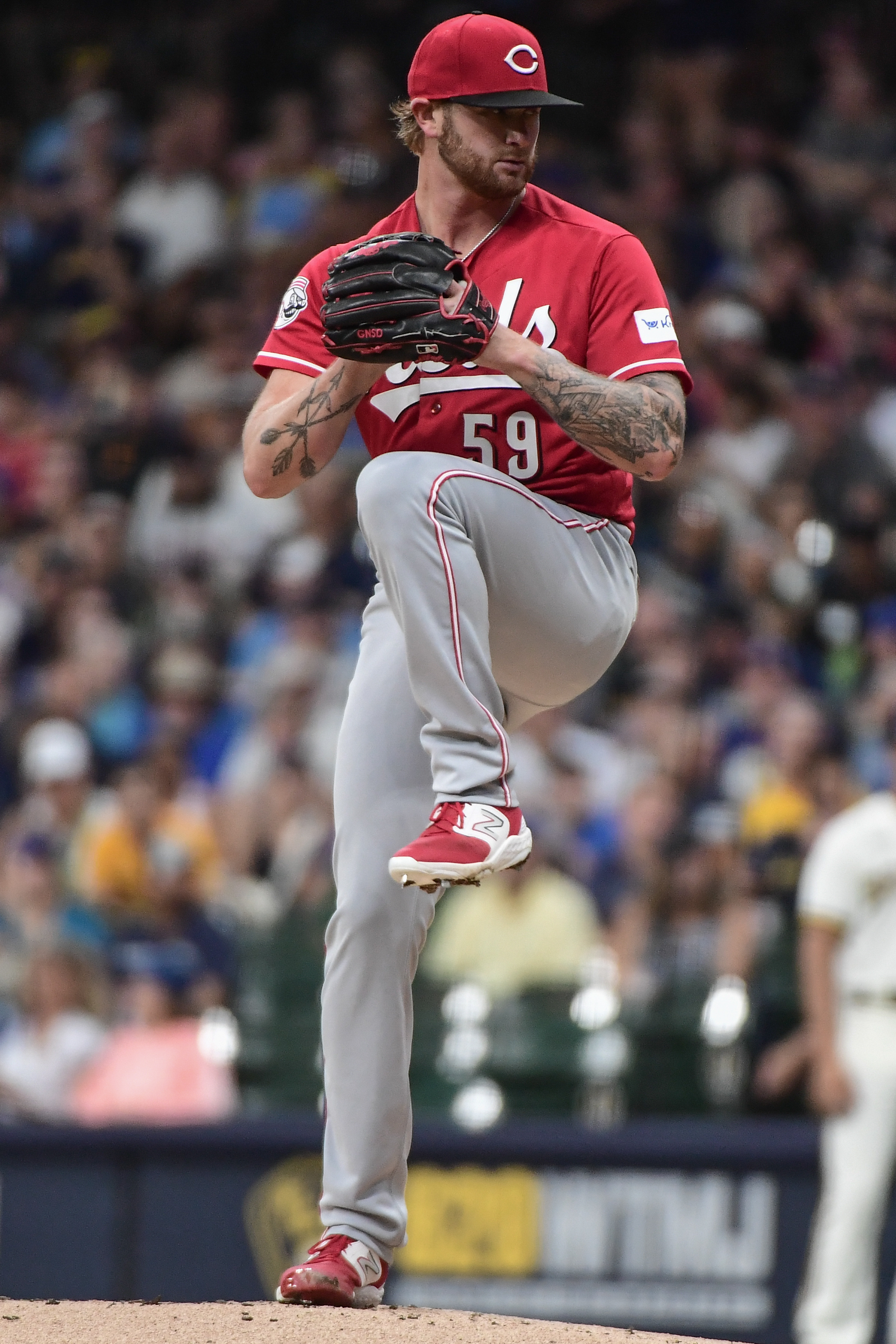 MILWAUKEE, WI - JULY 26: Milwaukee Brewers starting pitcher Freddy Peralta  (51) delivers a pitch during an MLB game against the Cincinnati Reds on  July 26, 2023 at American Family Field in