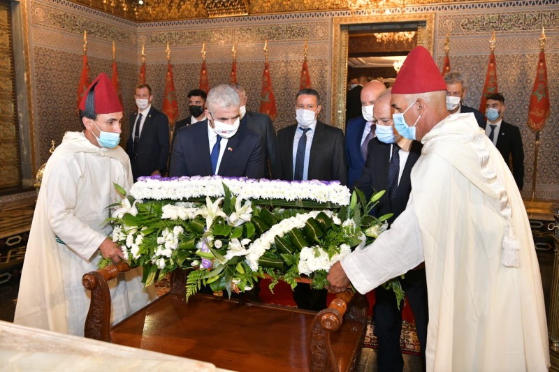 Israeli Foreign Minister Yair Lapid lays a wreath during his visit to the Mausoleum of Mohammed V in Rabat