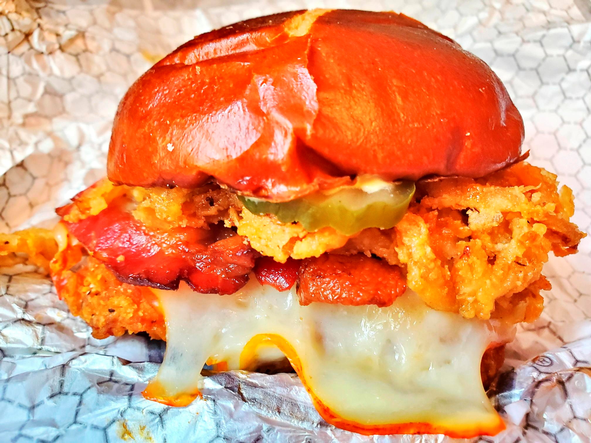 View shows Wendy's Spicy Pretzel Bacon Pub Chicken sandwich, in New York
