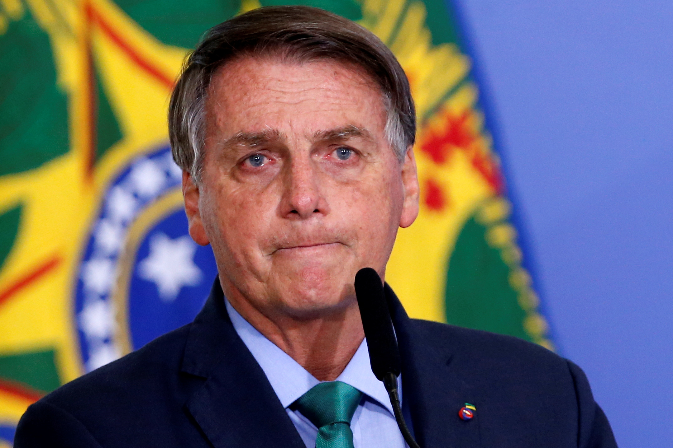 Brazil's President Jair Bolsonaro looks on during a ceremony at the Planalto Palace in Brazil