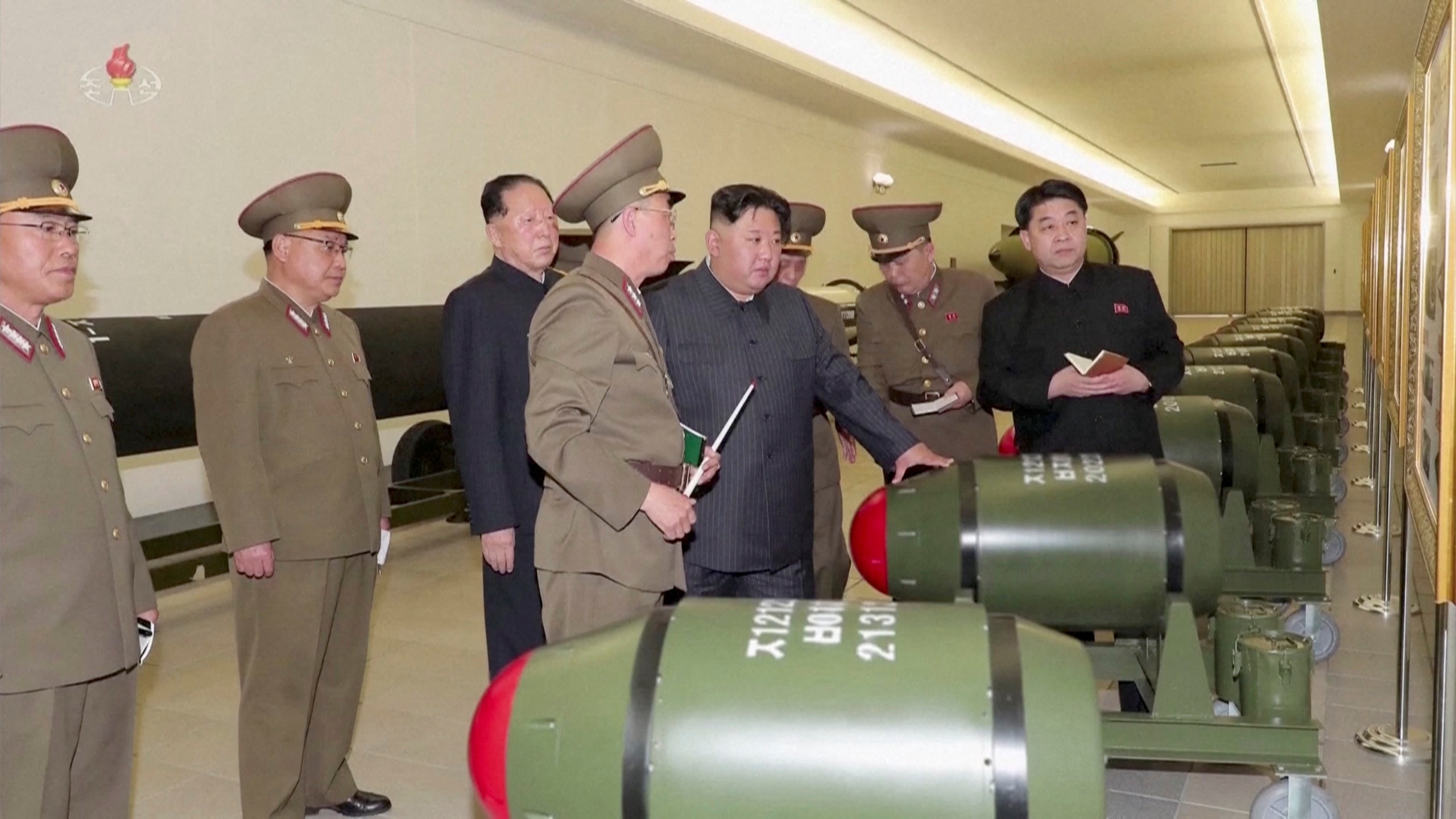 North Korean leader Kim Jong Un inspects nuclear warheads at an undisclosed location