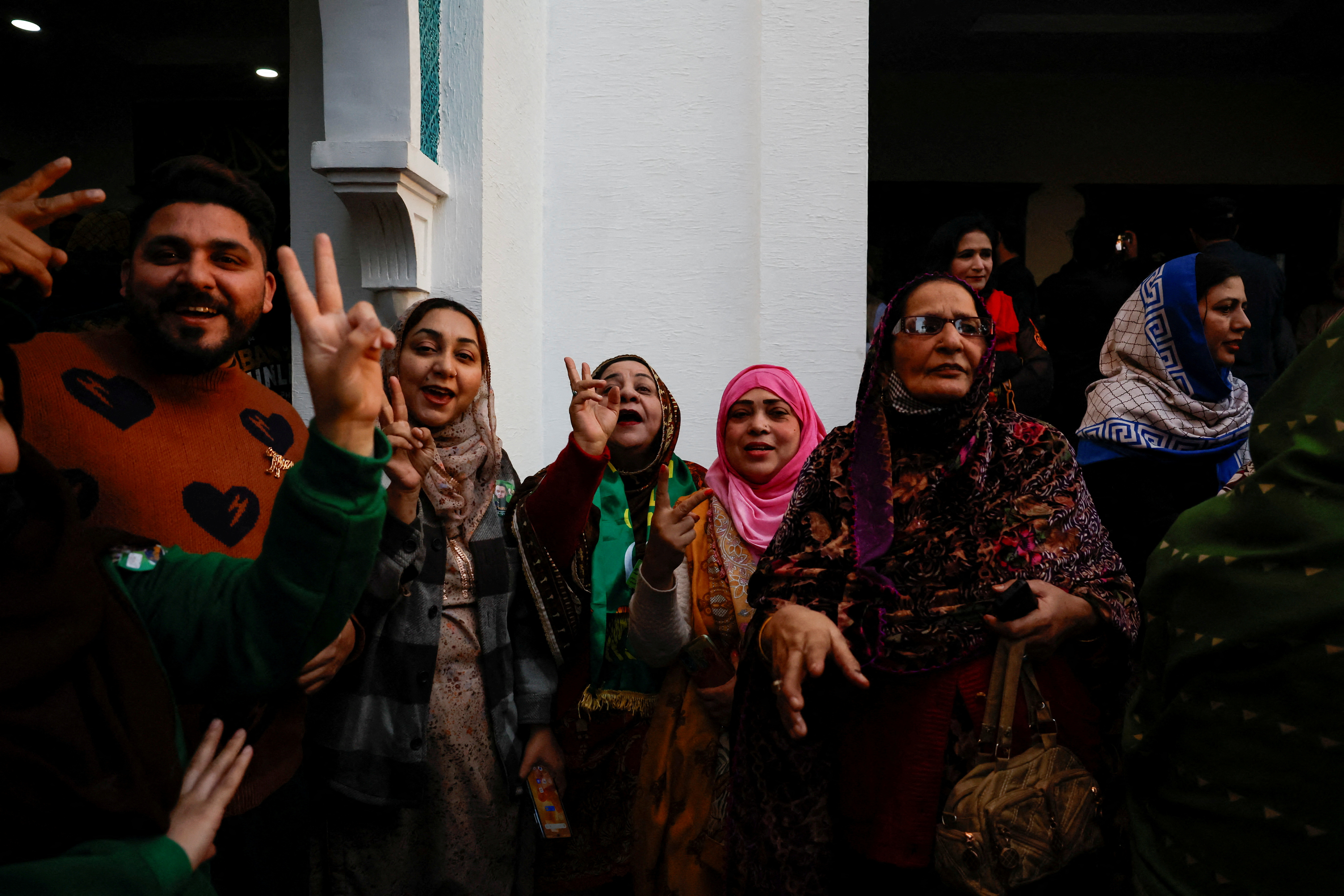 Supporters of Former Prime Minister of Pakistan Nawaz Sharif cheer as they gather at the party office of Pakistan Muslim League (N) at Model Town in Lahore