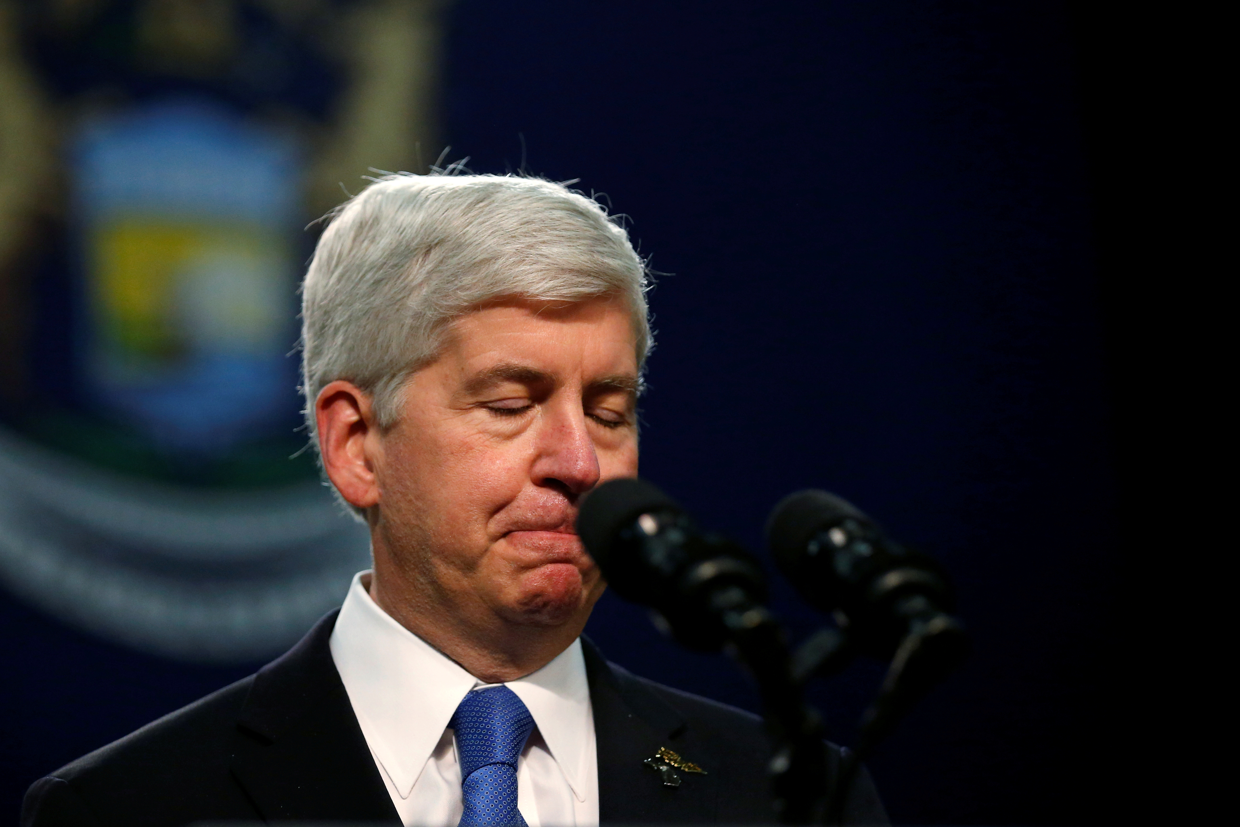 Michigan Governor Rick Snyder pauses as he speaks at North Western High School in Flint, a city struggling with the effects of lead-poisoned drinking water in Michigan