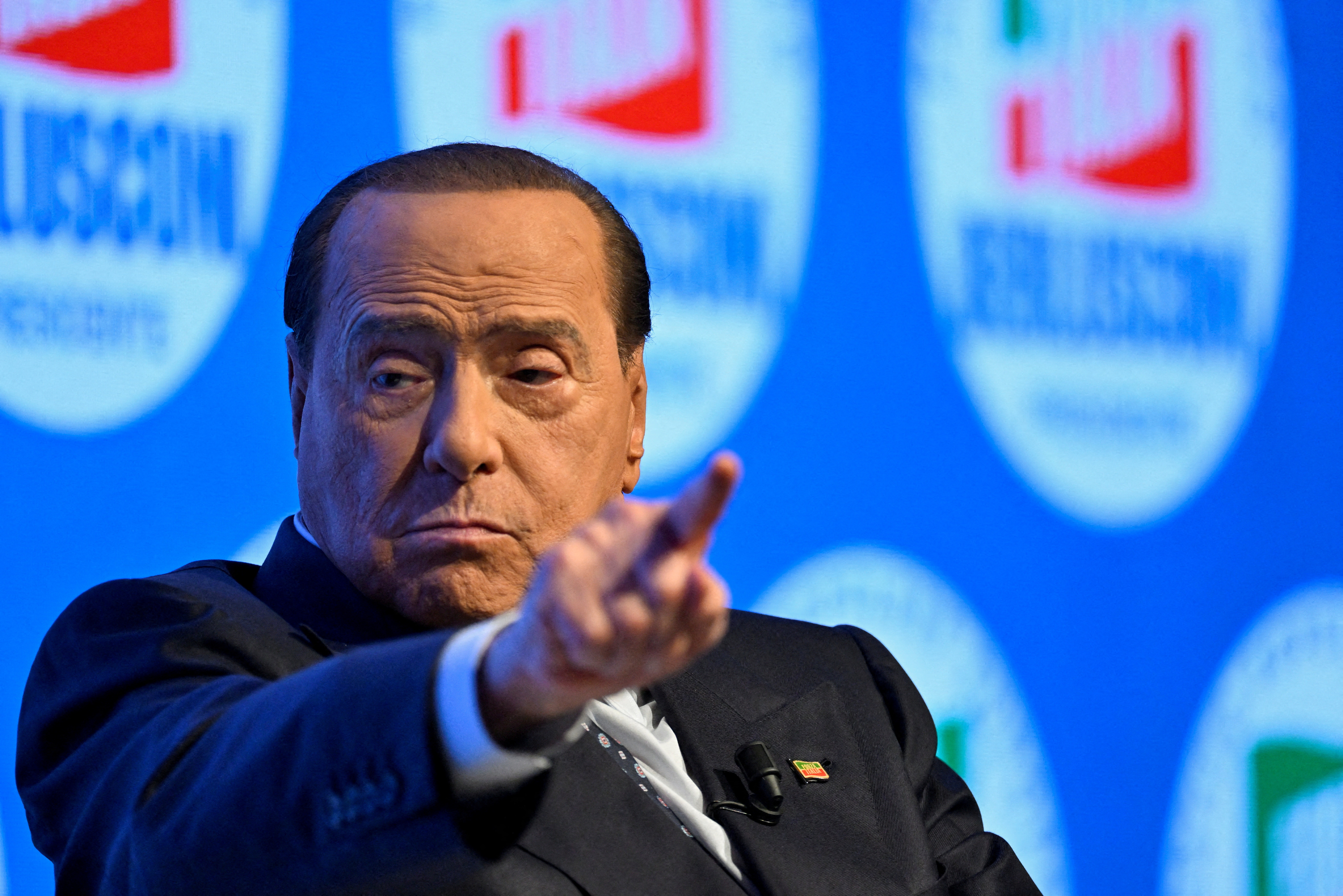 Former Italian prime minister Silvio Berlusconi gestures during a campaign rally