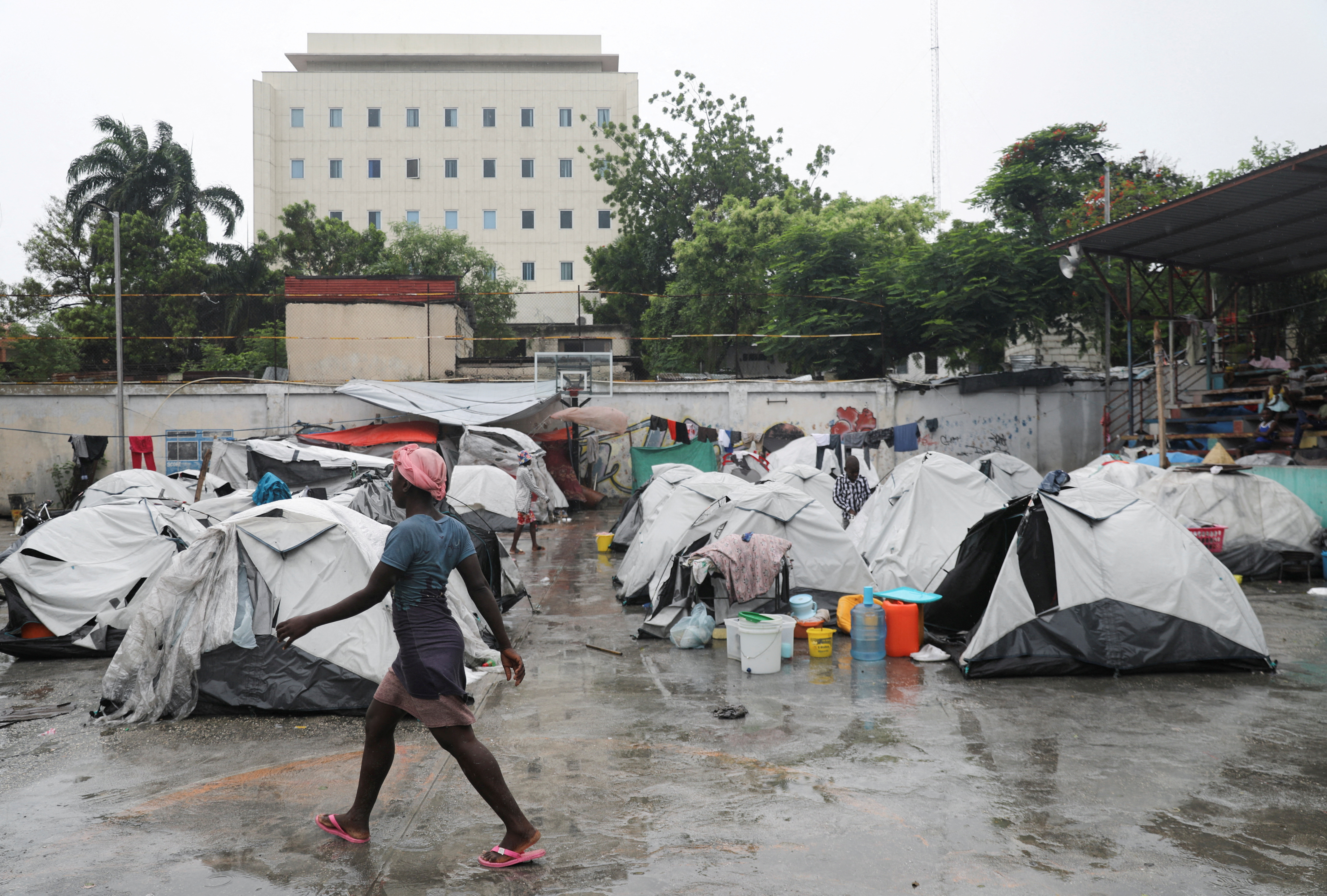People displaced by gang violence shelter at a school, in Port-au-Prince