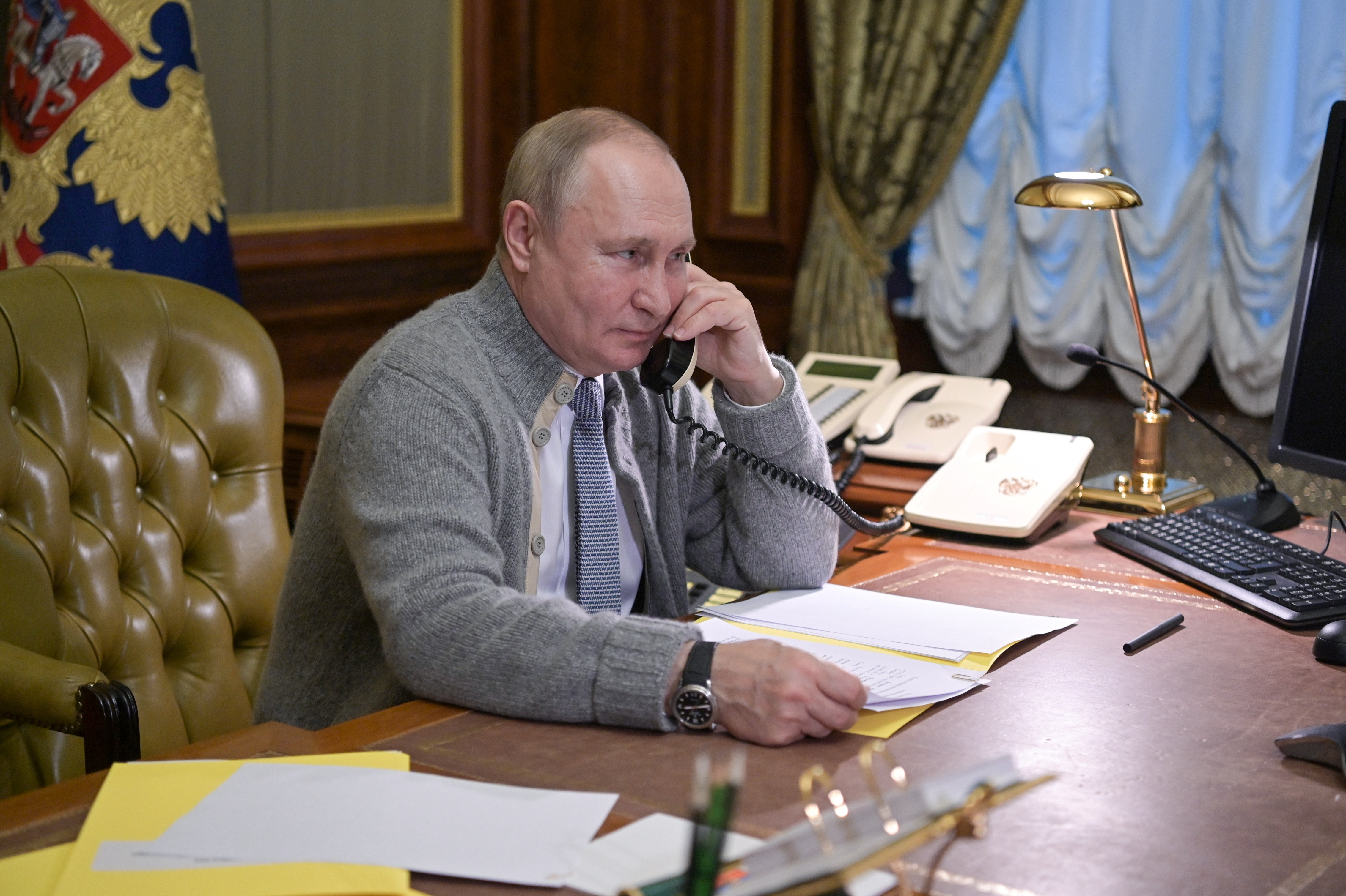 Russian President Putin speaks with a participant of a Christmas charity event in St Petersburg