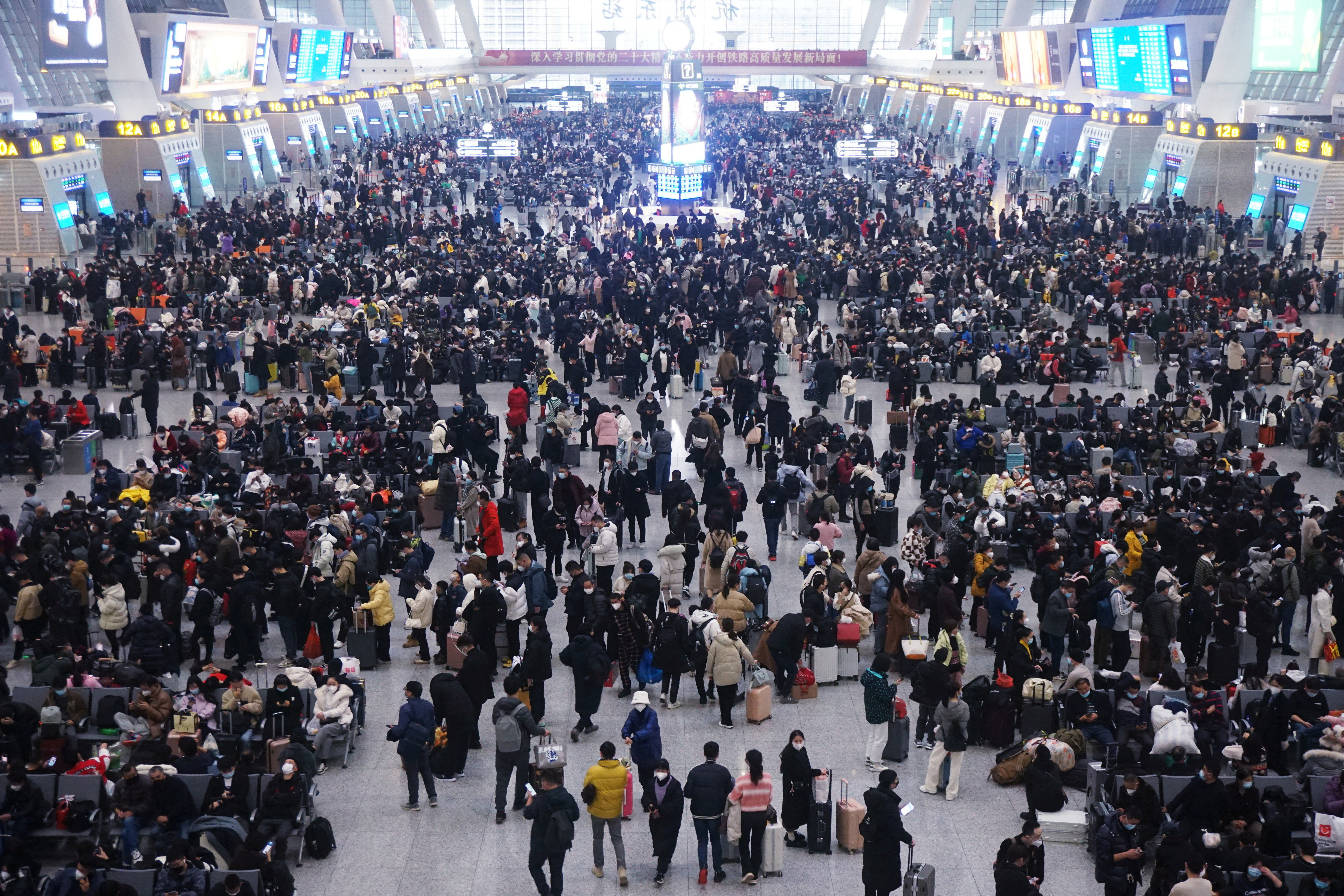 Travelers at Hangzhou East Railway Station before Chinese Lunar New Year
