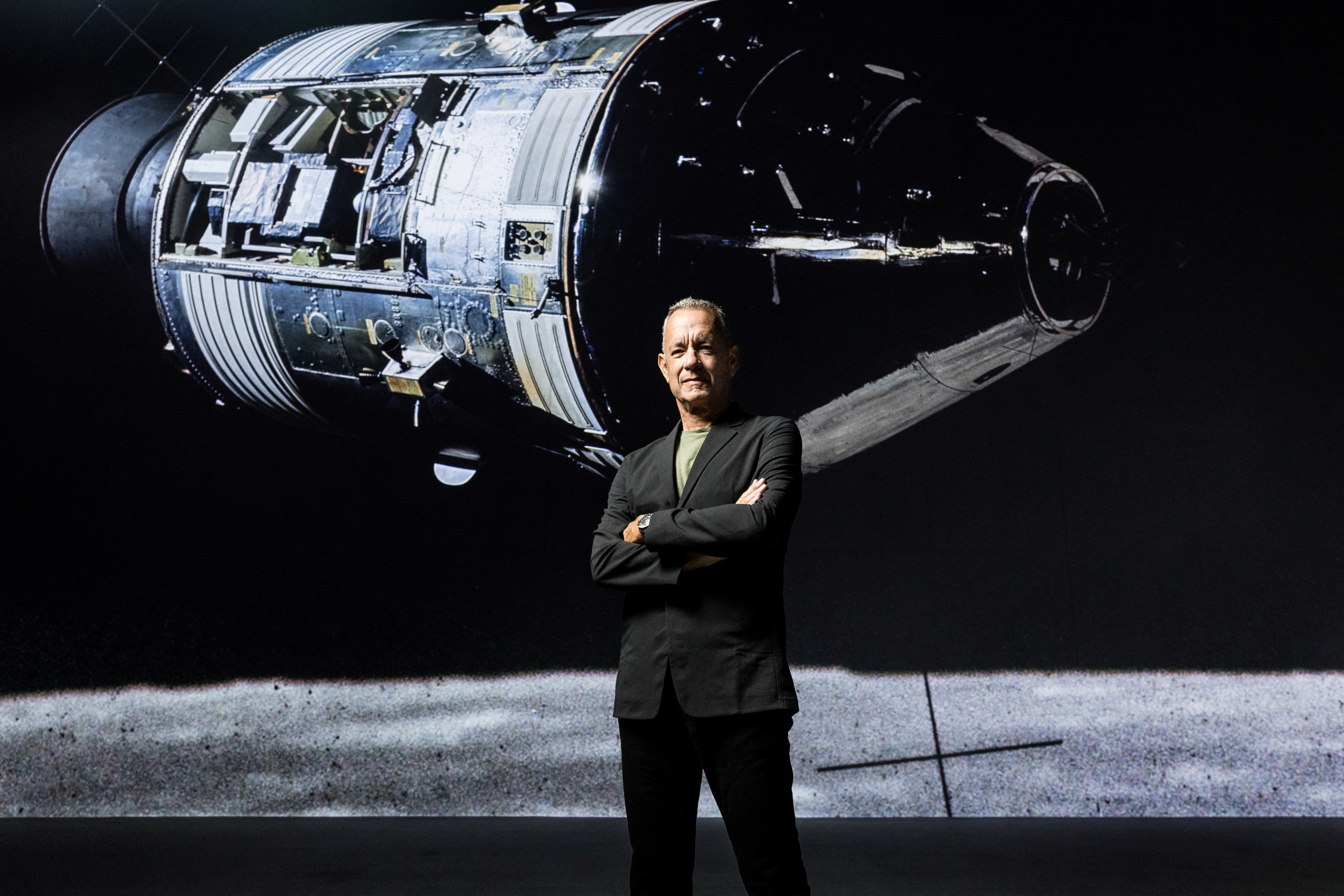 Tom Hanks poses at "The Moonwalkers: A Journey With Tom Hanks" immersive show, in London