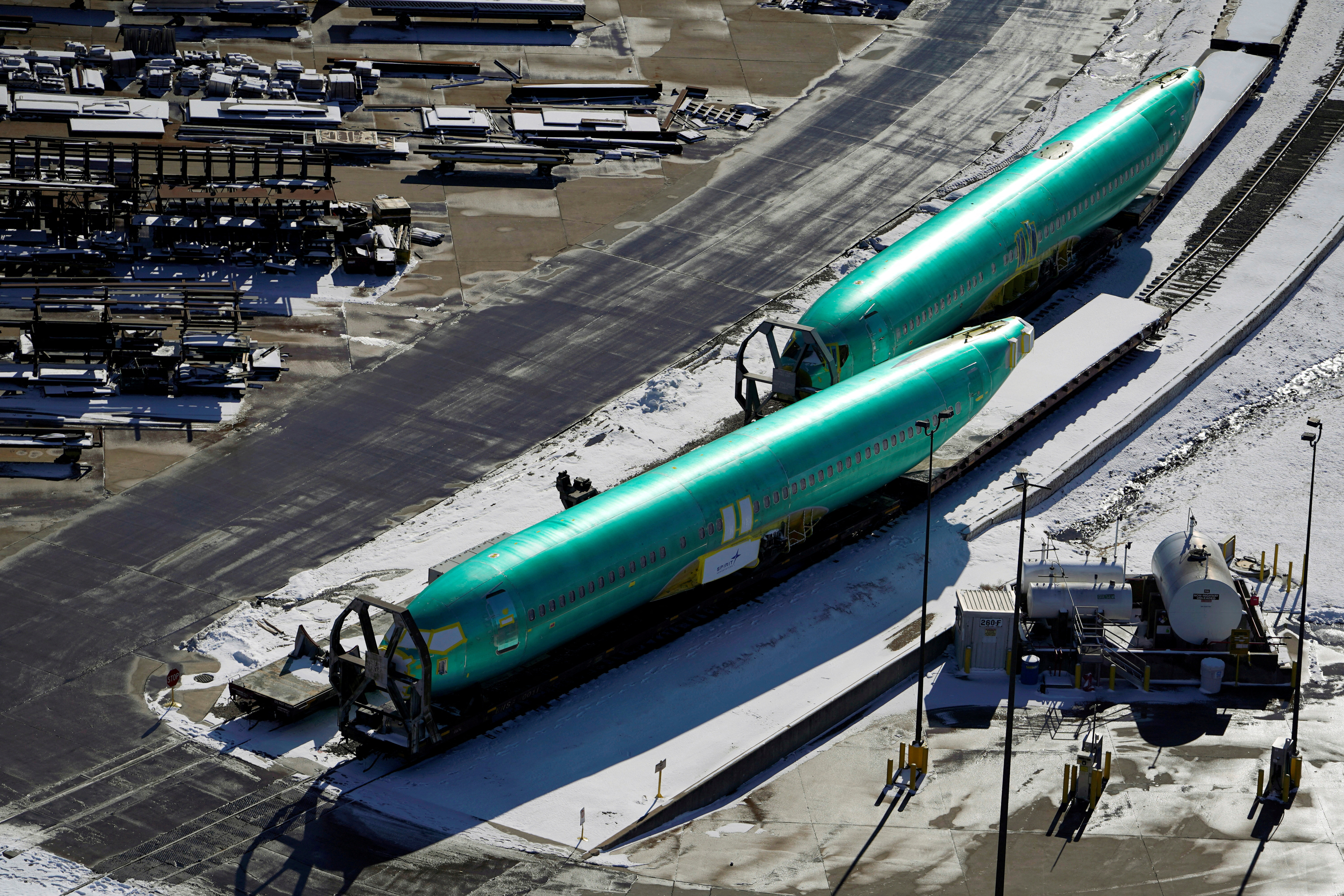 Airplane fuselages bound for Boeing's 737 Max production facility await shipment on rail sidings at their top supplier, Spirit AeroSystems Holdings Inc, in Wichita