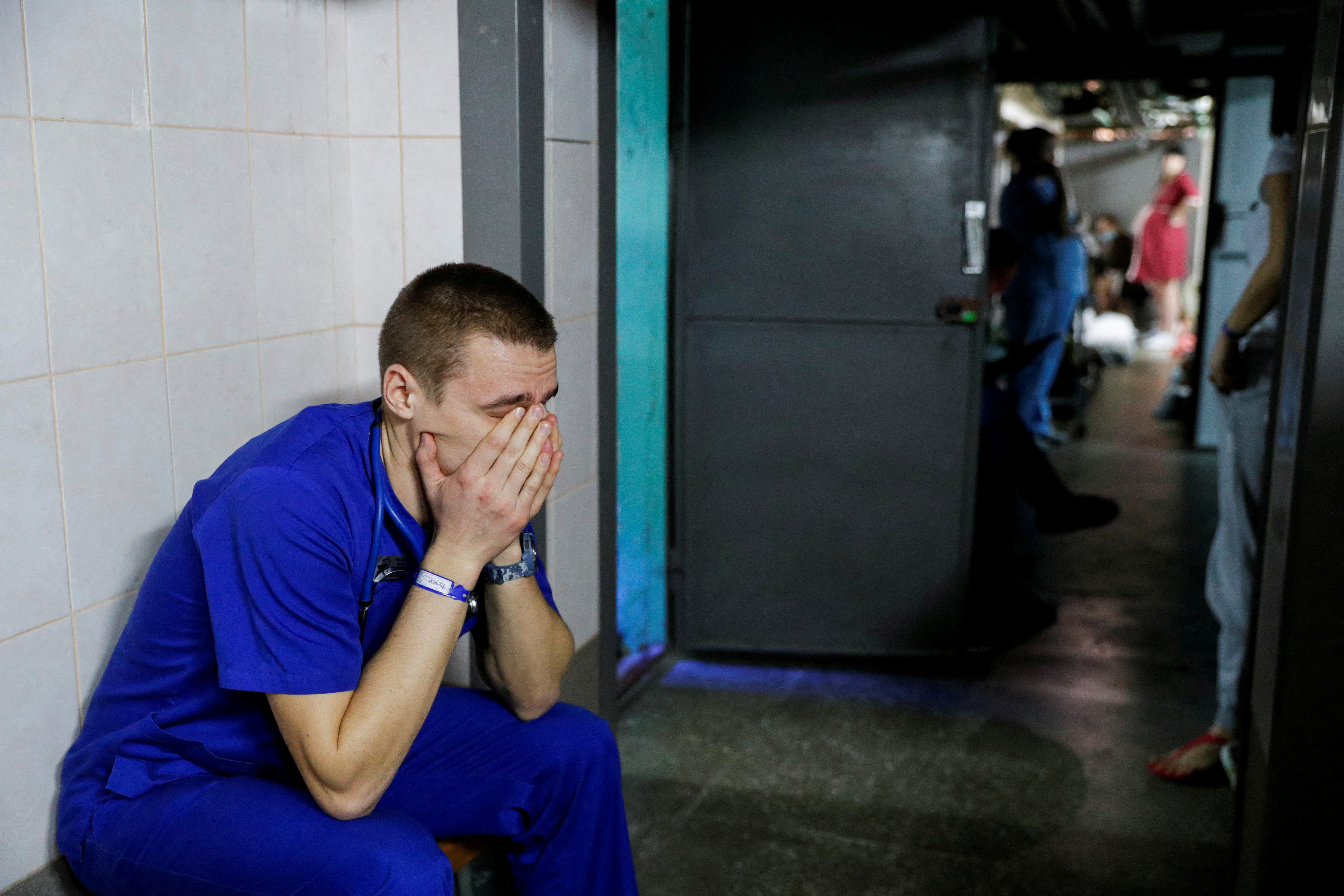 A doctor takes shelter in the basement of a perinatal centre as air raid siren sounds are heard in Kyiv