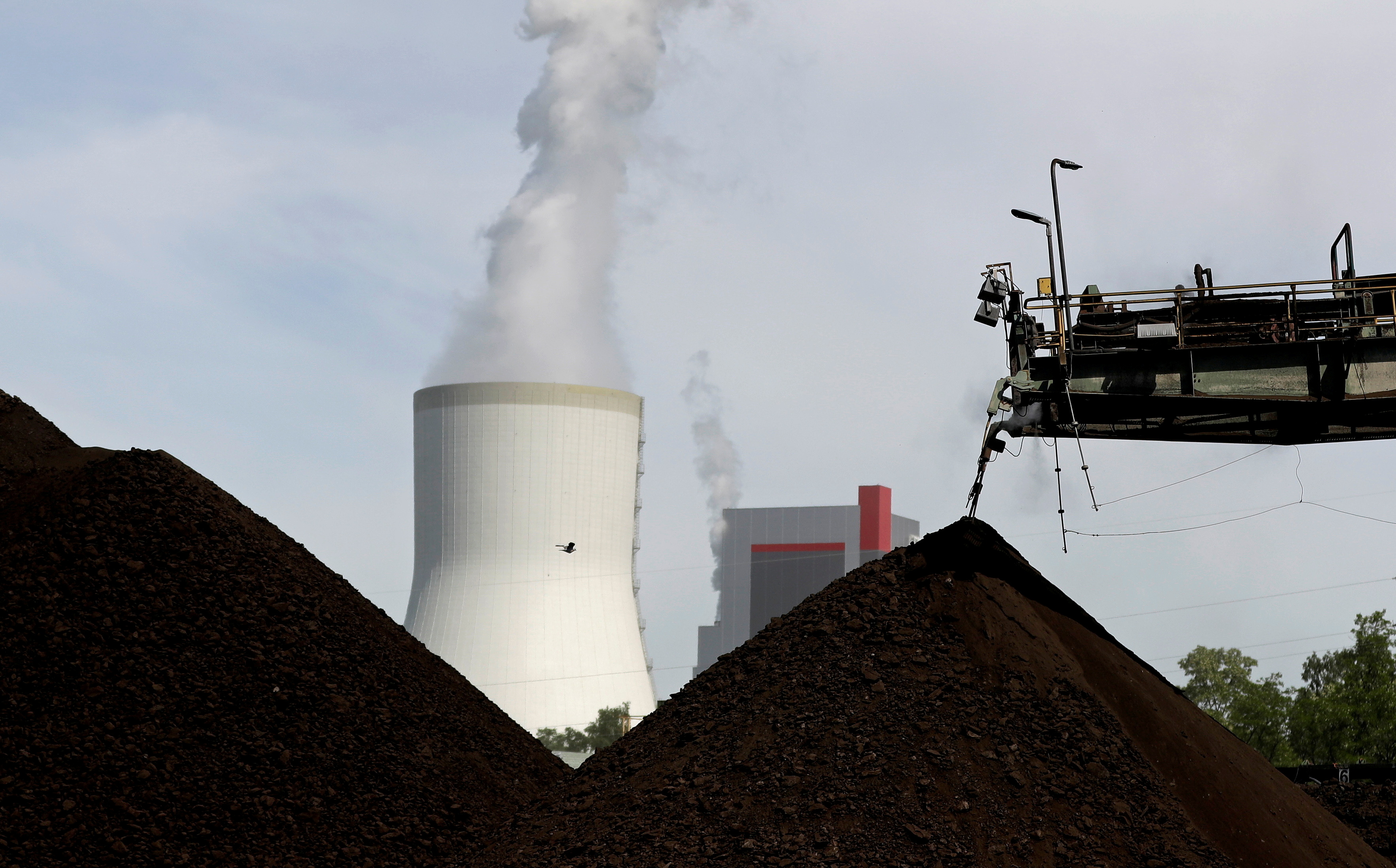 A cooling tower from the Turow coal-fired power plant is seen near the Turow open-pit coal mine in Bogatynia, Poland