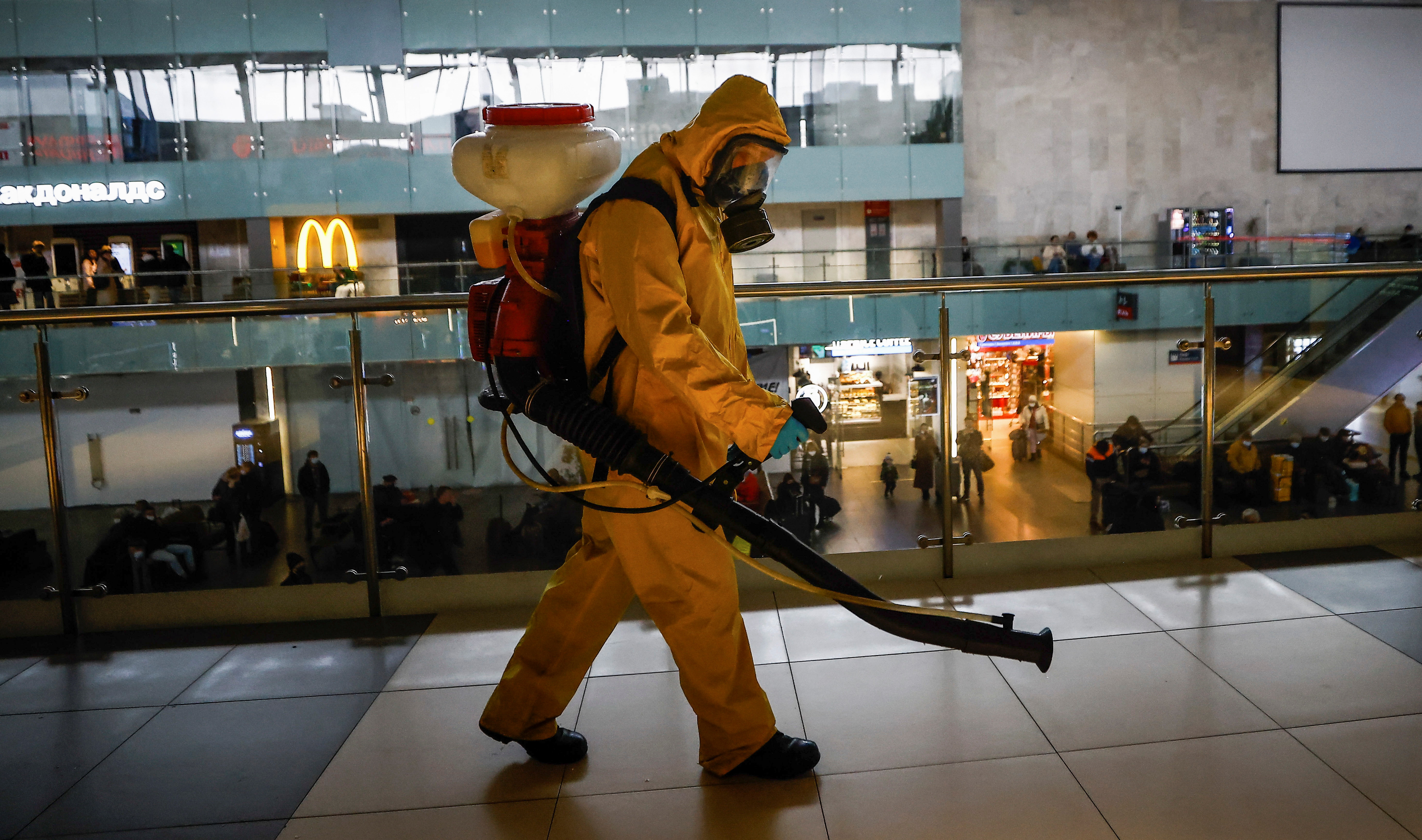 A specialist sanitizes a railway station amid the outbreak of the coronavirus disease in Moscow