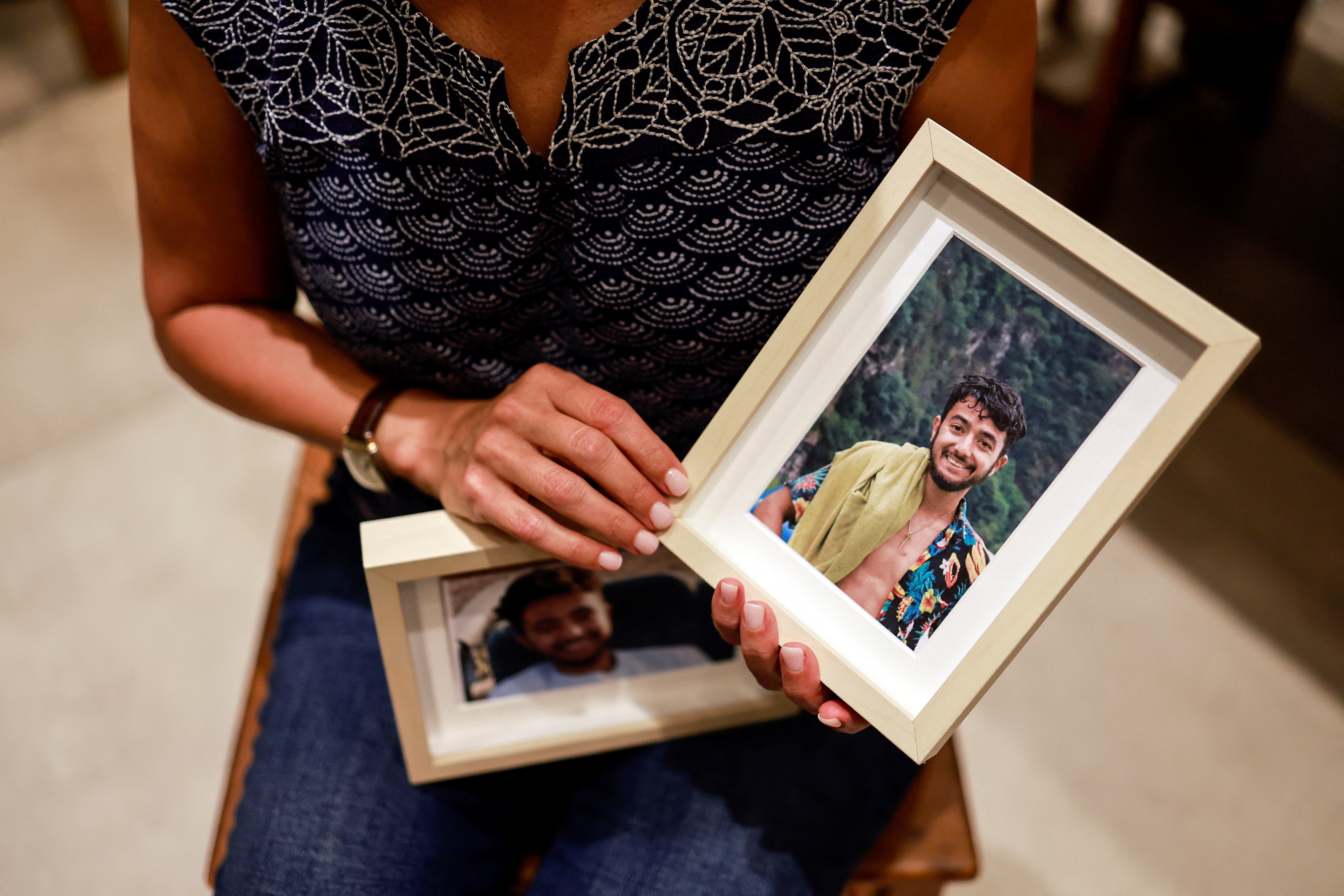 Rachel Goldberg, U.S.-Israeli mother of Hersh Goldberg Polin, which was taken hostage by Hamas militants into the Gaza Strip holds photos of her son, in Jerusalem