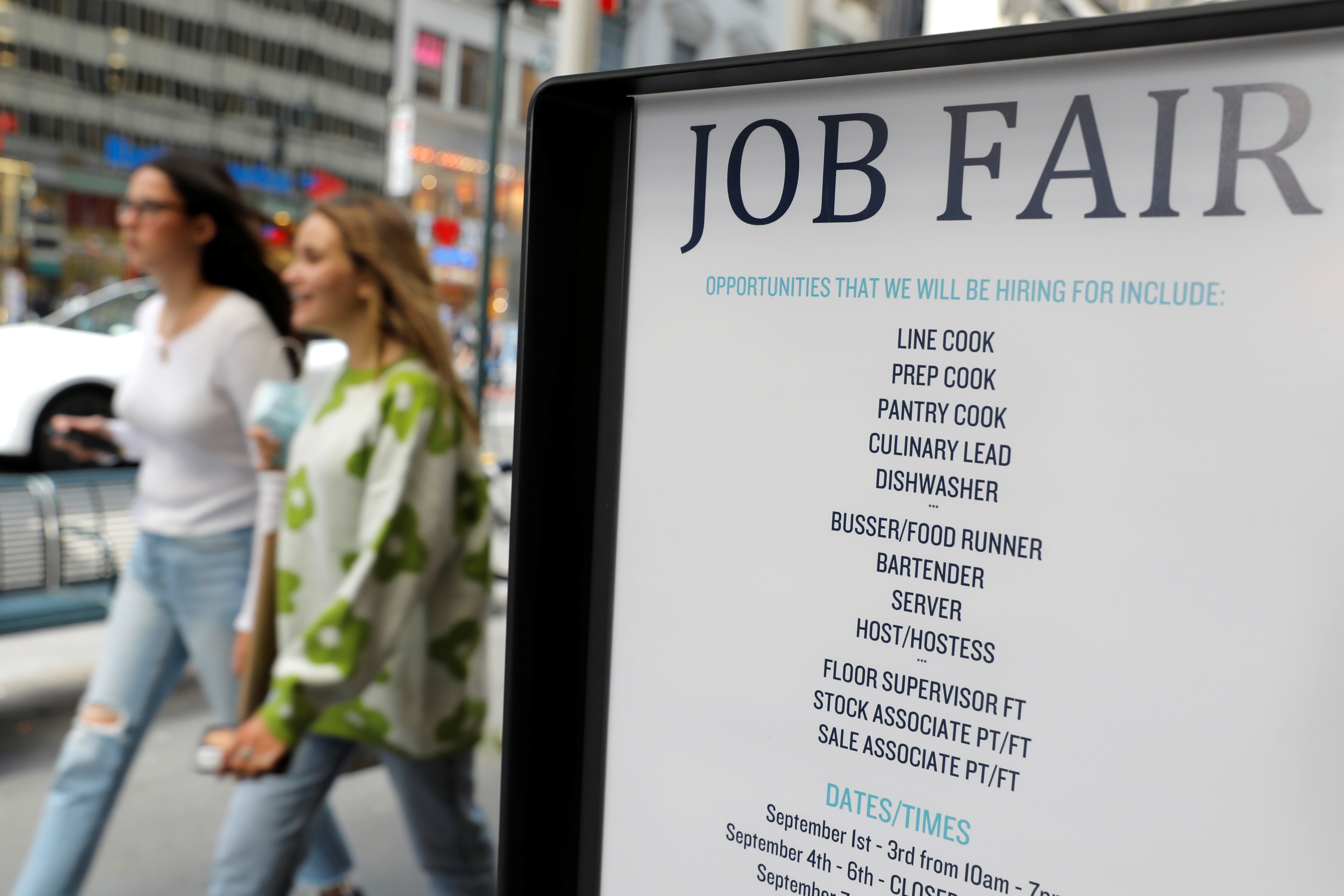 Signage for a job fair is seen on 5th Avenue after the release of the jobs report in Manhattan, New York City