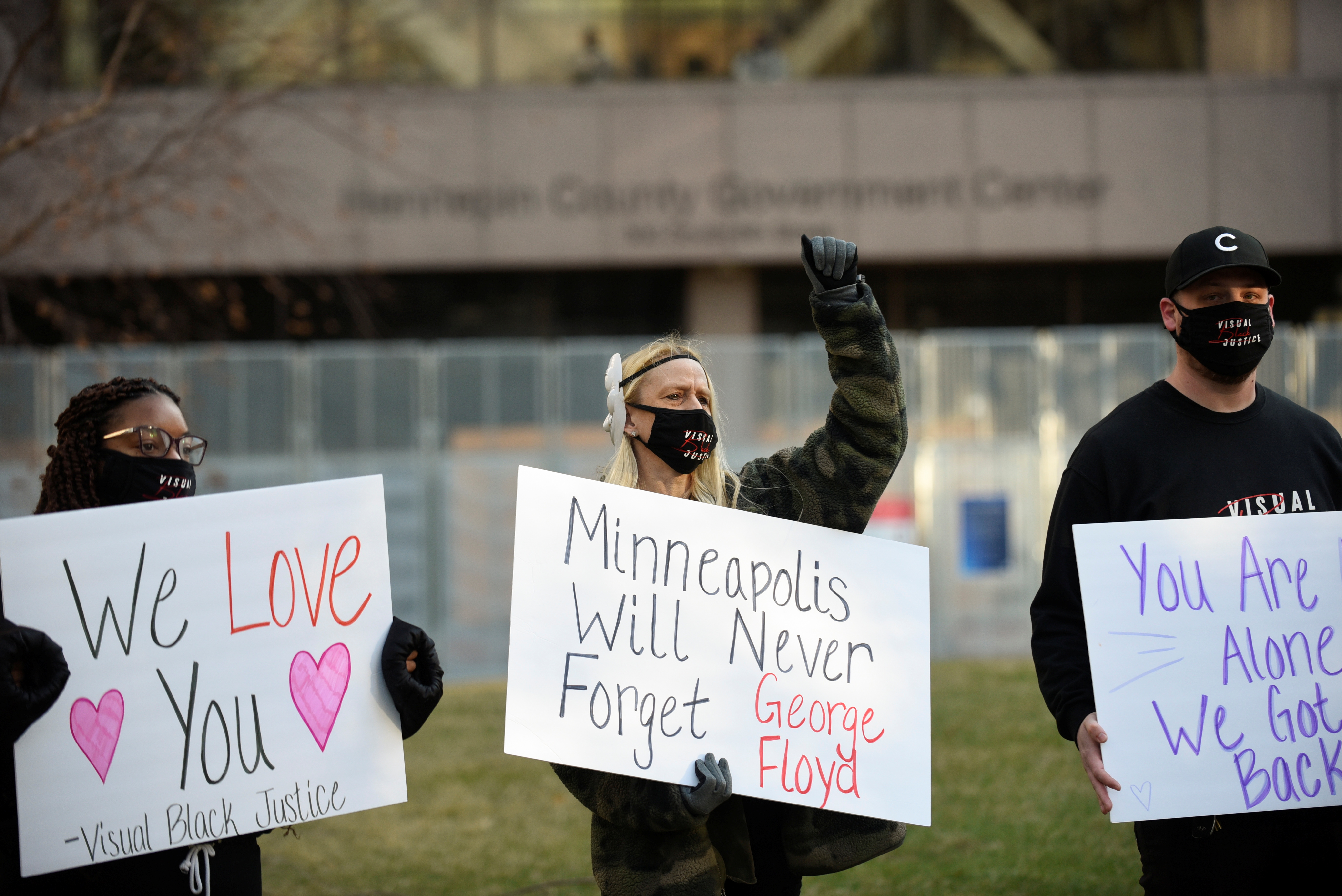 People demonstrate outside the Hennepin County Government Center during the first day of the trial of former police Derek Chauvin, who is facing murder charges in the death of George Floyd, in Minneapolis, Minnesota, U.S., March 29, 2021. REUTERS/Nicholas Pfosi