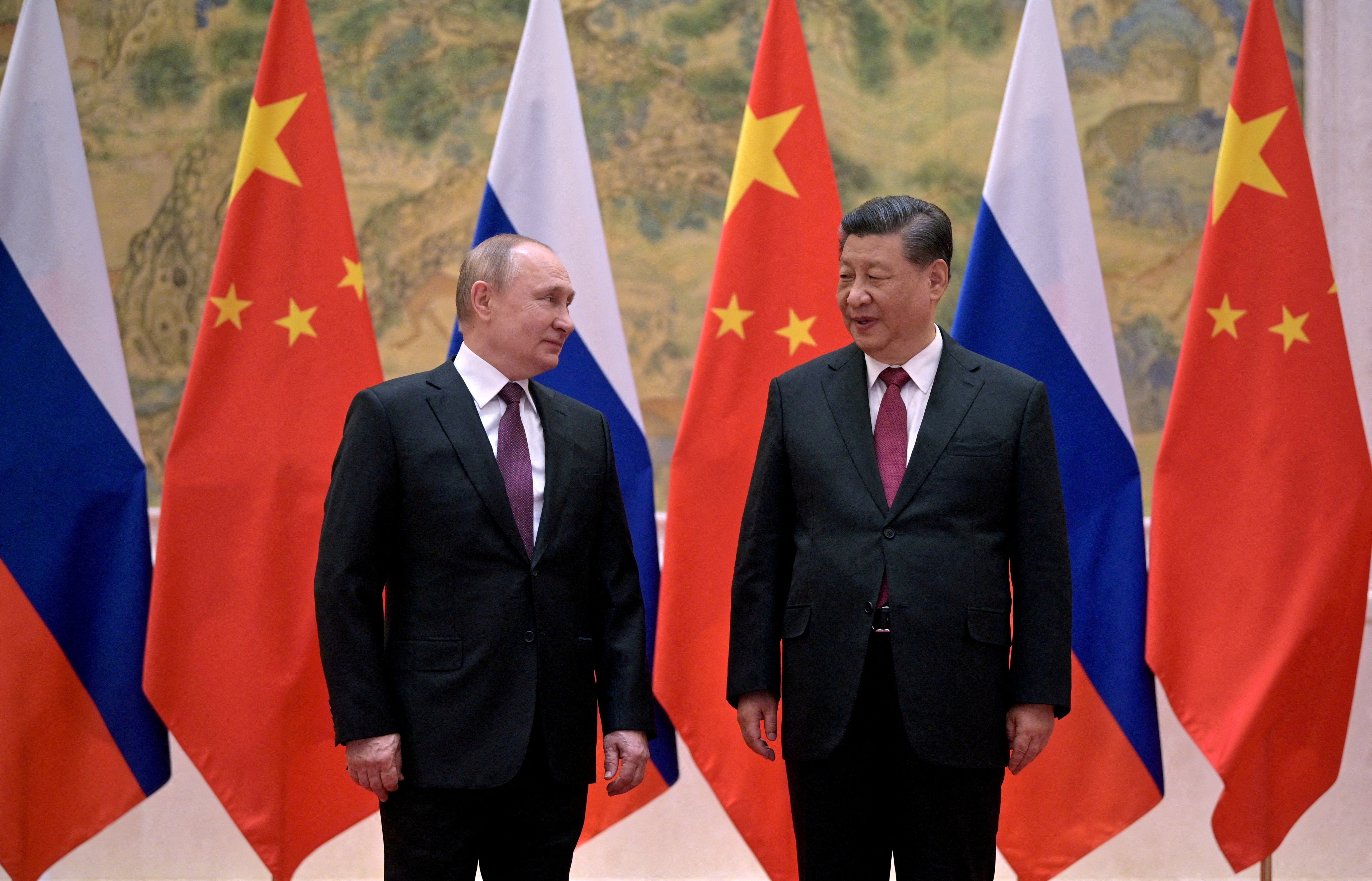 Russian President Vladimir Putin attends a meeting with Chinese President Xi Jinping