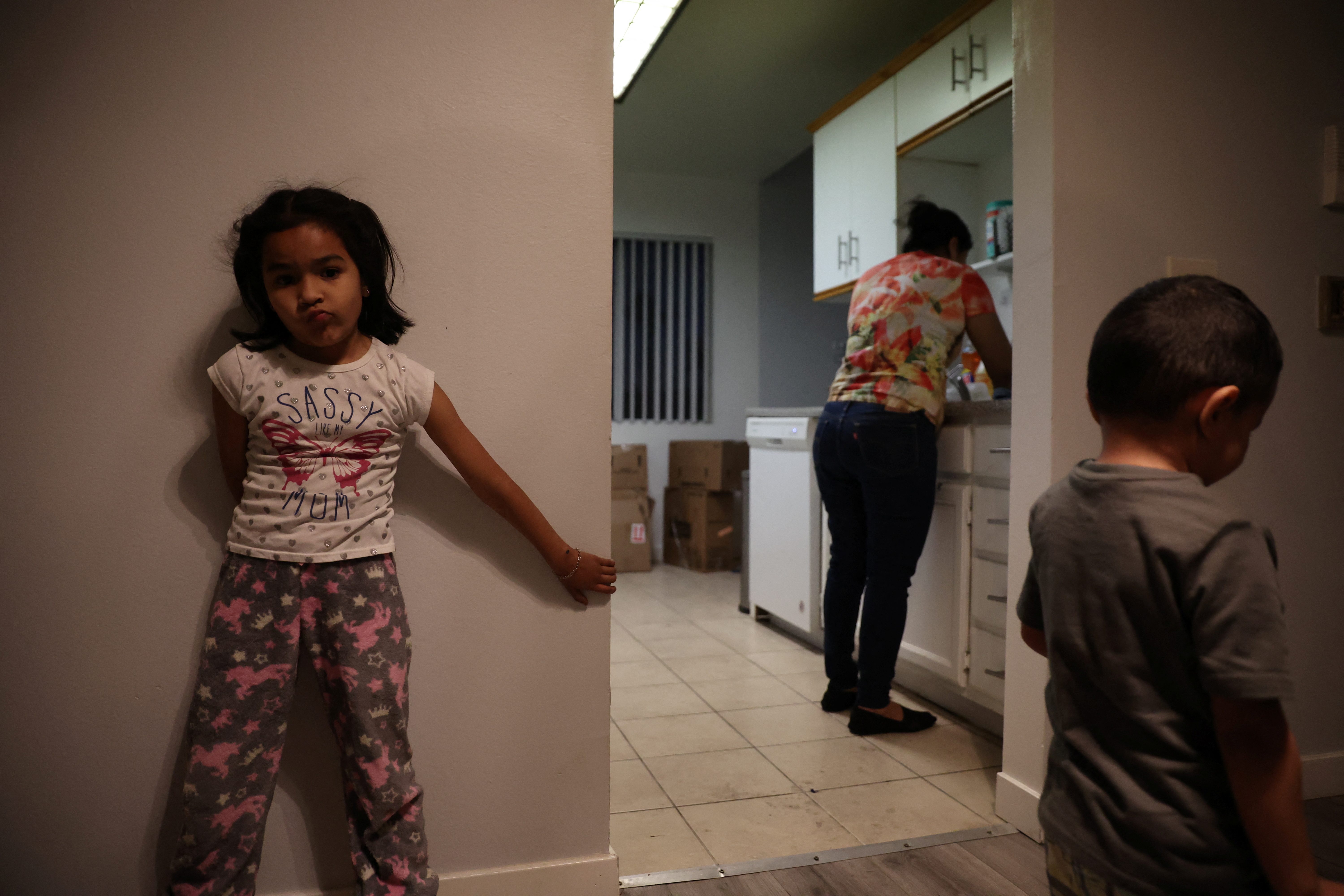 Maria Hernandez along with her daughter and grandson are seen at a temporary apartment in Los Angeles