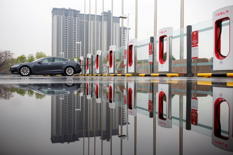 A Tesla car pictured at a charging point in Beijing, China, April 13, 2018. REUTERS/Thomas Peter/File Photo