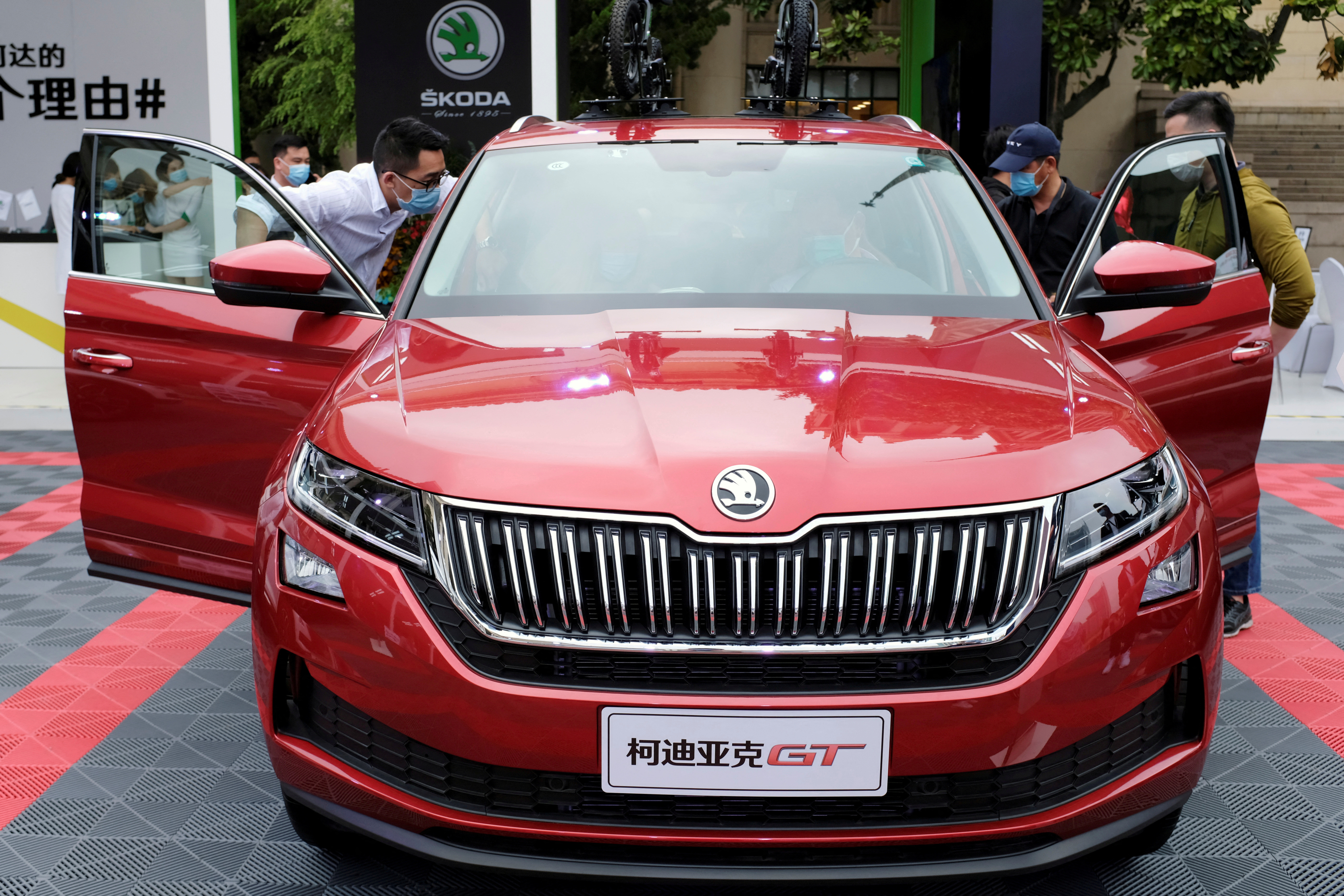Visitors check a Skoda vehicle at a sales event in Shanghai