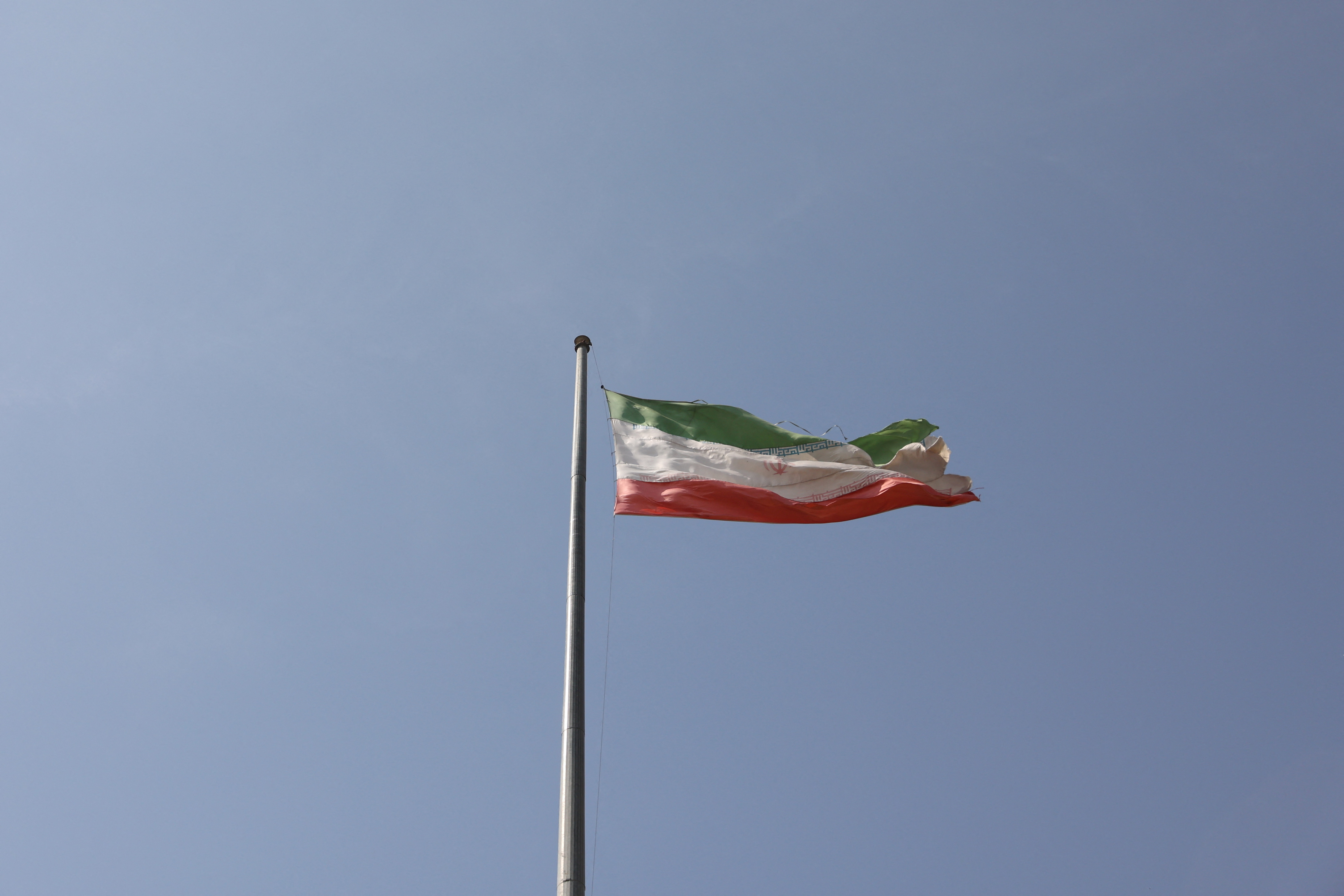 Iranian flag is seen flying over Evin prison in Tehran