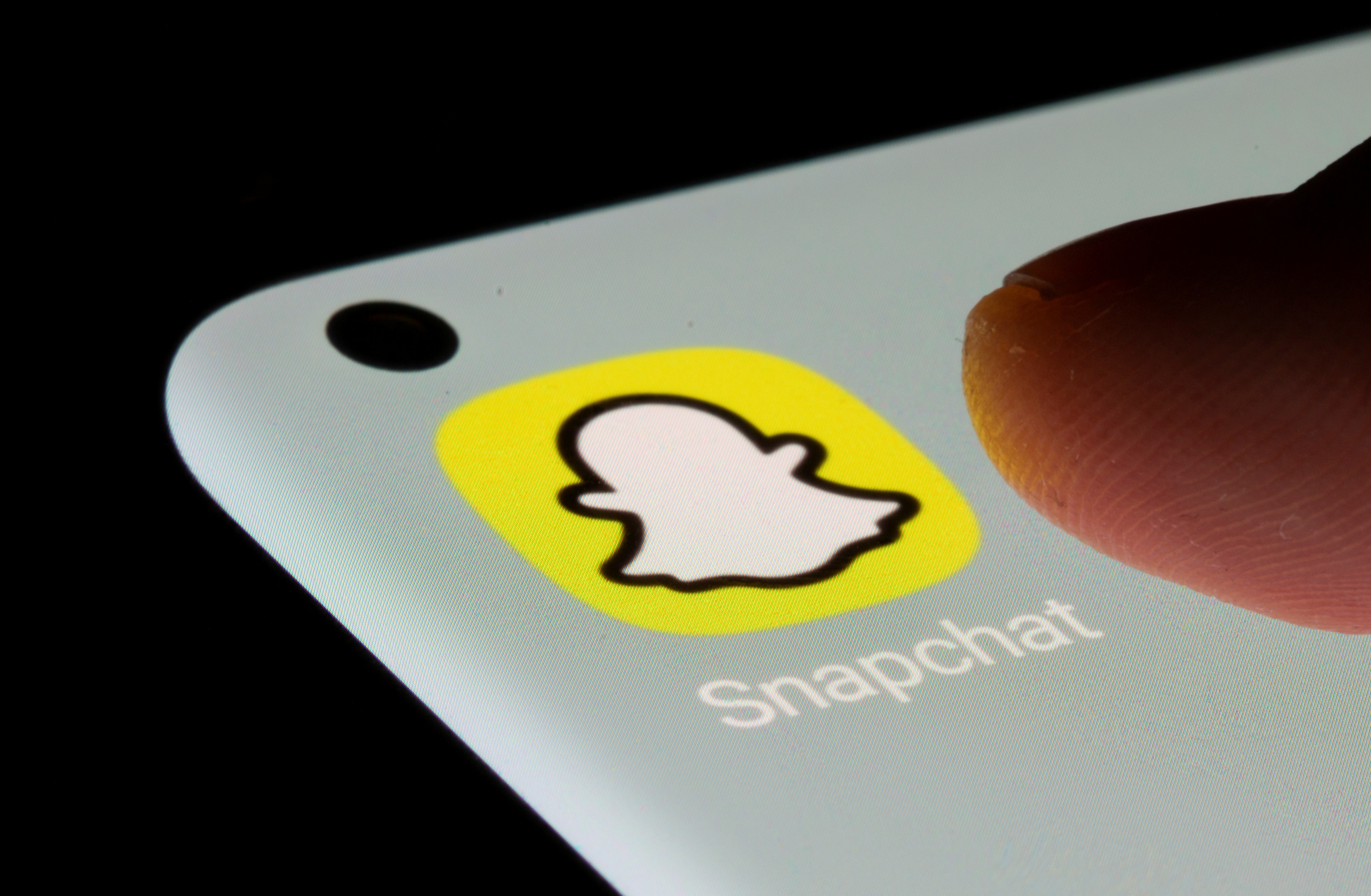 Snapchat app is seen on a smartphone in this illustration