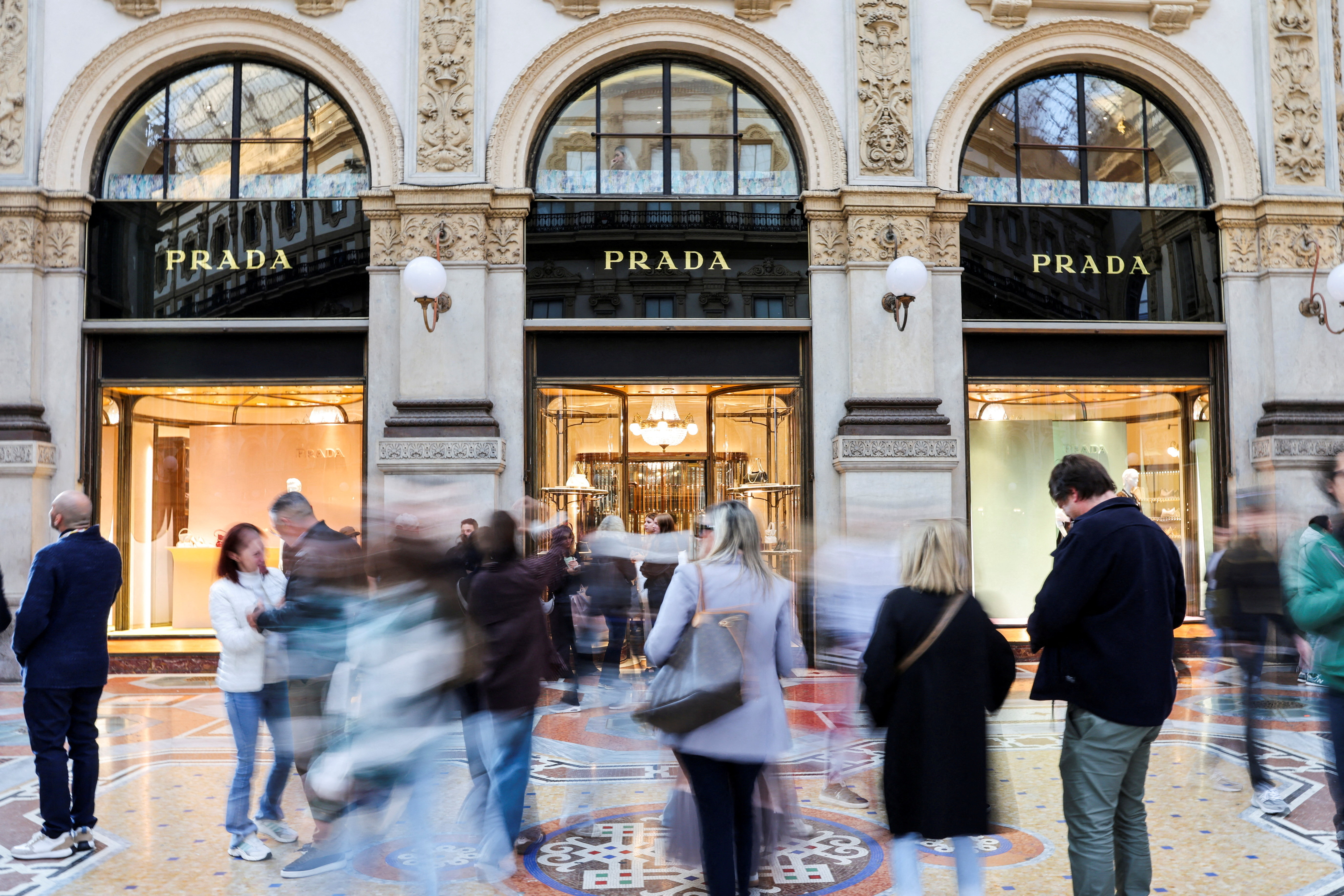Prada plans to cut outlets and lower brands at Versace | Reuters