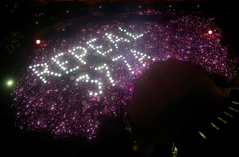 Participants of Pink Dot, an annual event organised in support of the LGBT community, gather in a formation protesting the repeal of Section 377A of Singapore's Penal Code, at the Speakers' Corner in Hong Lim Park in Singapore