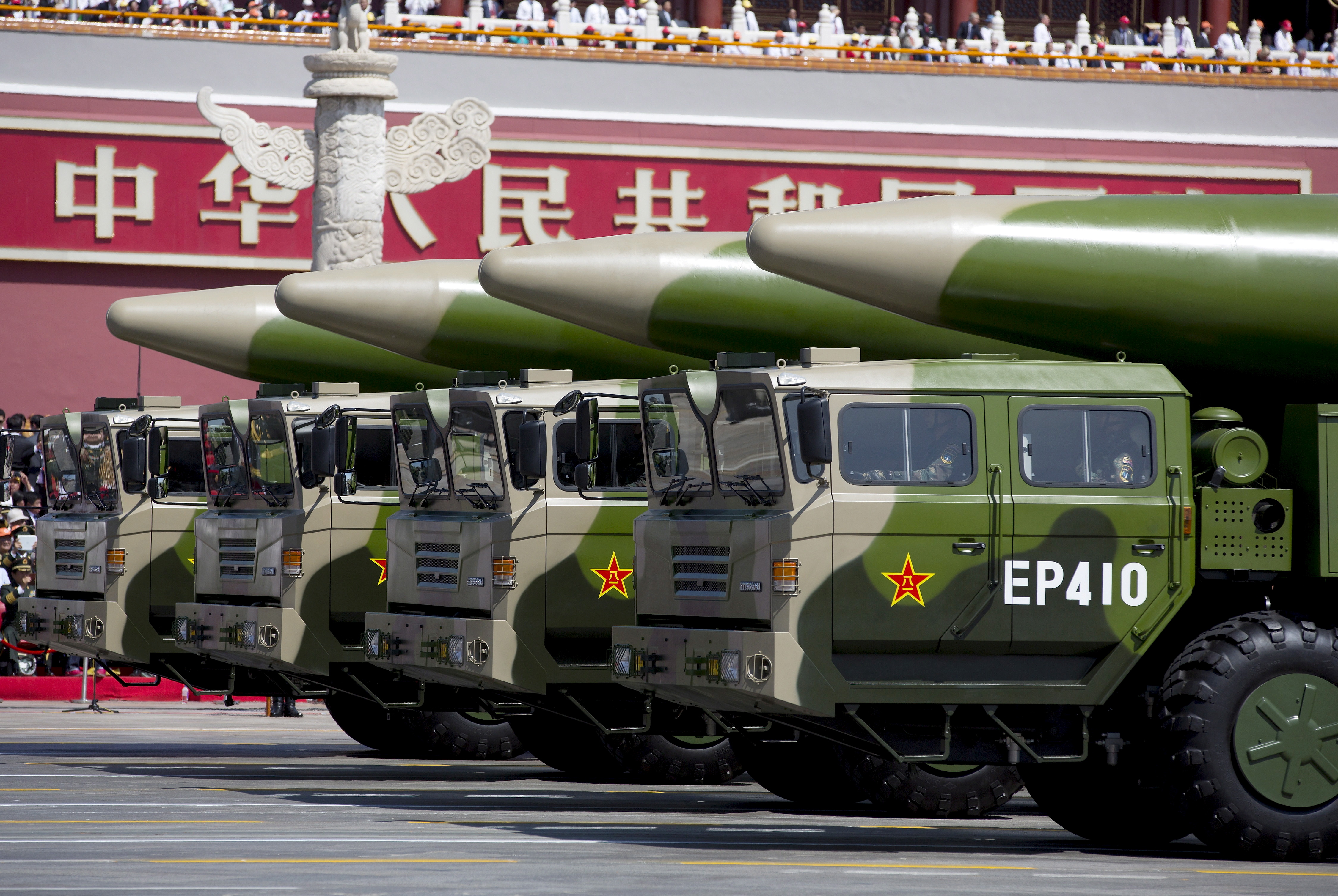 Military vehicles carrying DF-26 ballistic missiles travel past Tiananmen Gate during a military parade to commemorate the 70th anniversary of the end of World War II in Beijing