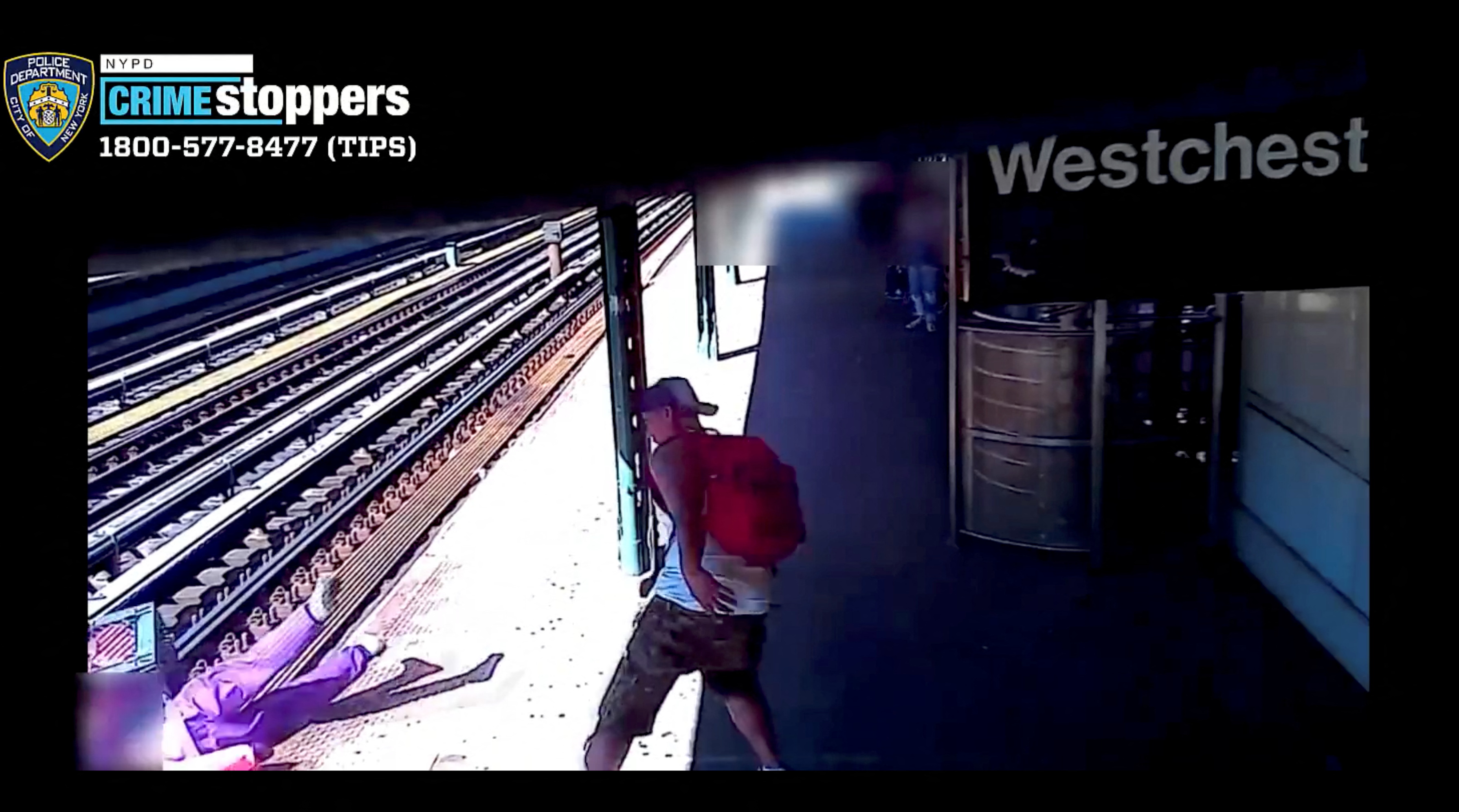 Man throws woman onto train tracks in New York