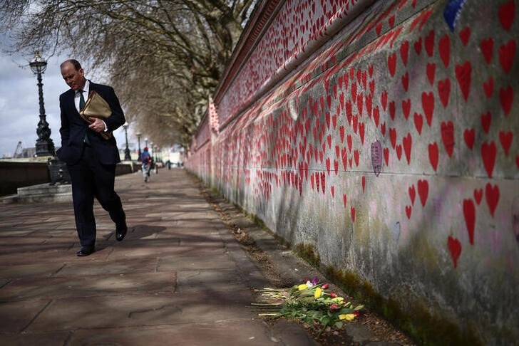 Visitors to The National Covid Memorial Wall on the third anniversary of the United Kingdom going into a national lockdown