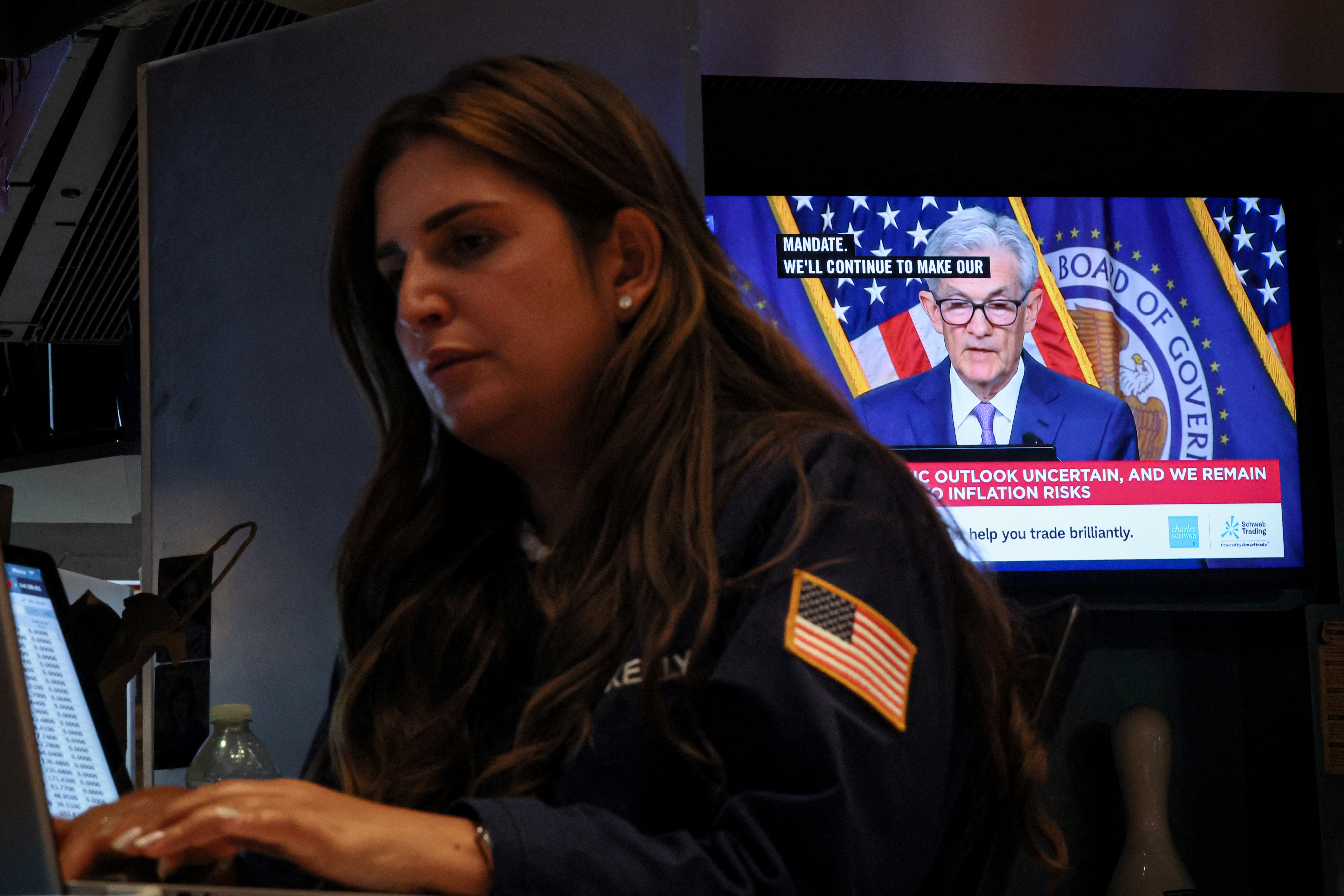 Traders react to Fed rate announcement on the floor of the NYSE in New York
